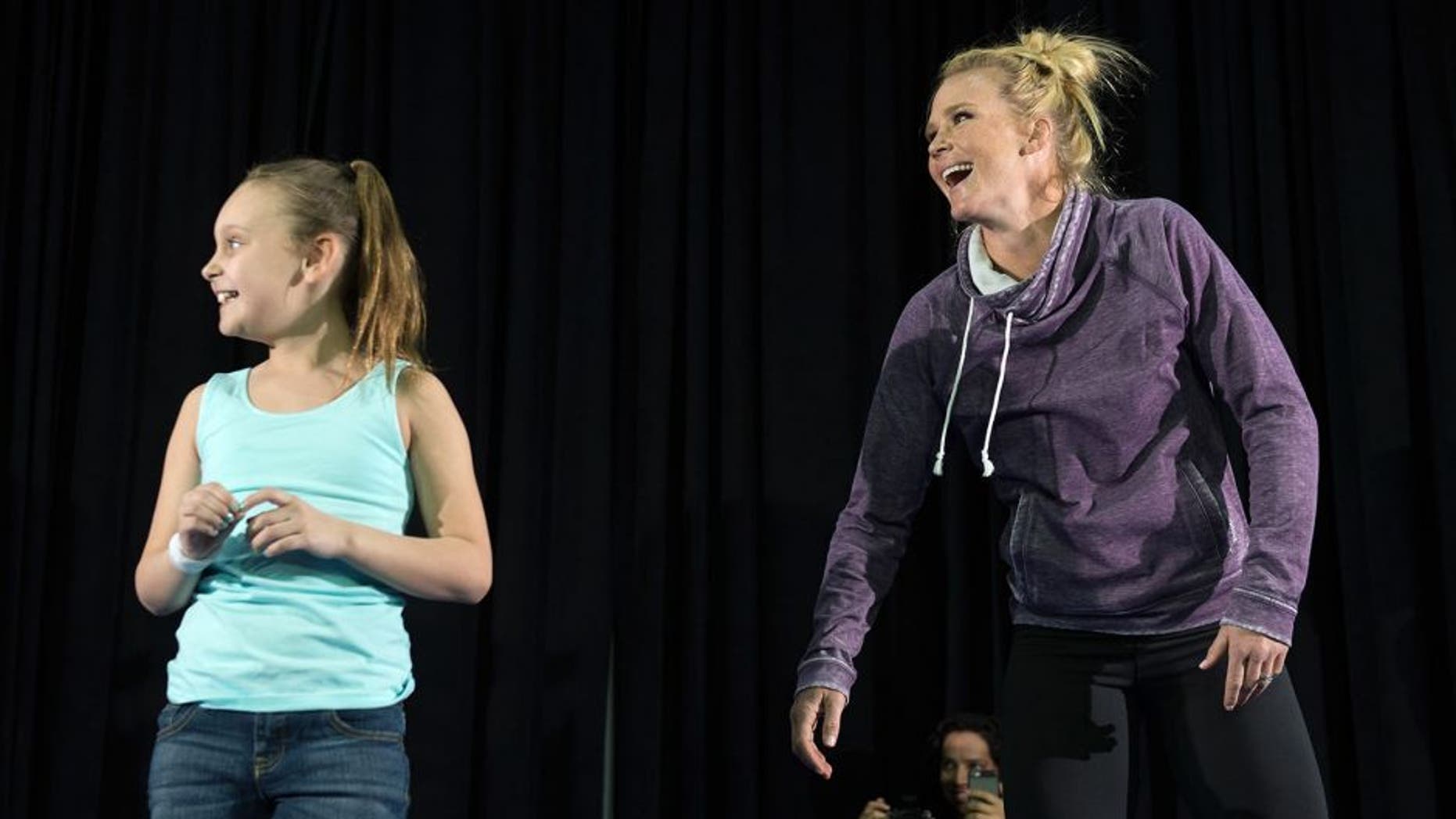 LAS VEGAS, NV - MARCH 2: UFC bantamweight champion Holly Holm brings a fan on stage and holds an open training session for fans and media at the Jabbawockeez Theater in the MGM Grand Hotel/Casino on March 2, 2016 in Las Vegas, Nevada. (Photo by Brandon Magnus/Zuffa LLC/Zuffa LLC via Getty Images)