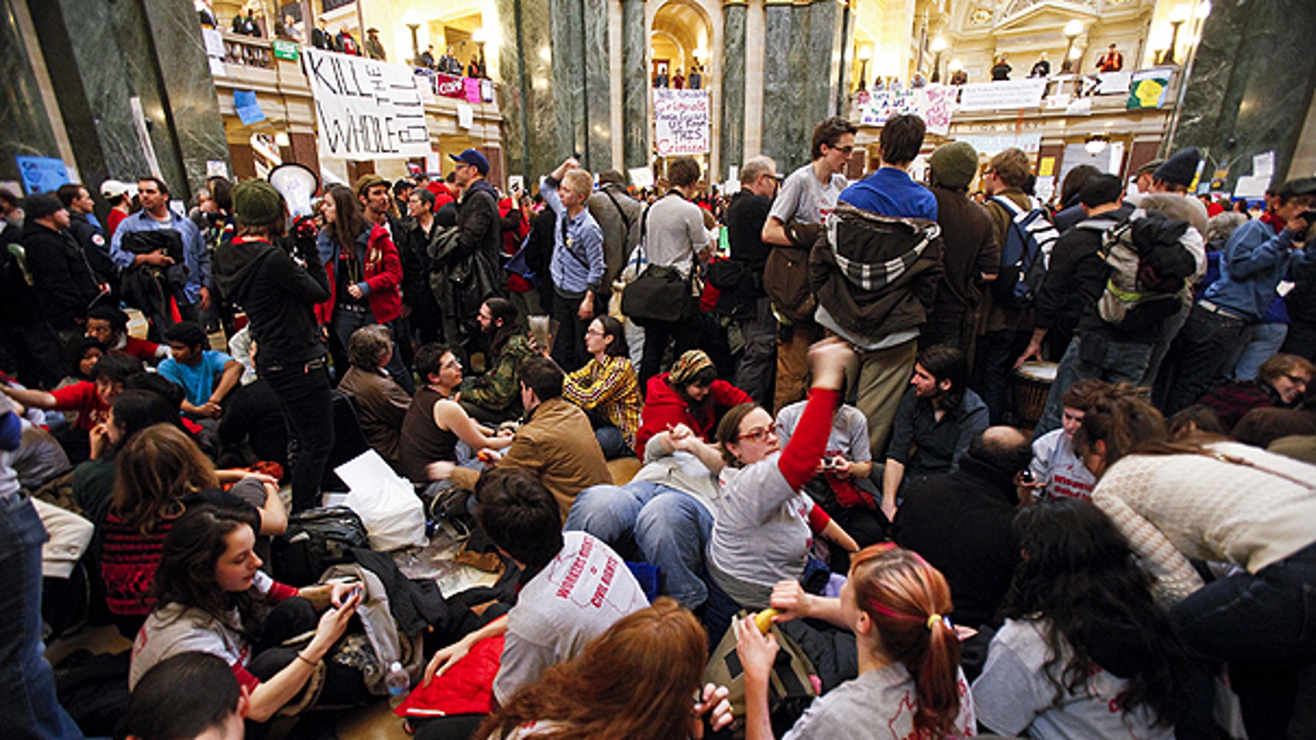 Feb. 27: Student Labor Action Coalition members demonstrate at the state Capitol in Madison, Wis., on the 13th day f protests over the governor's proposed budget.