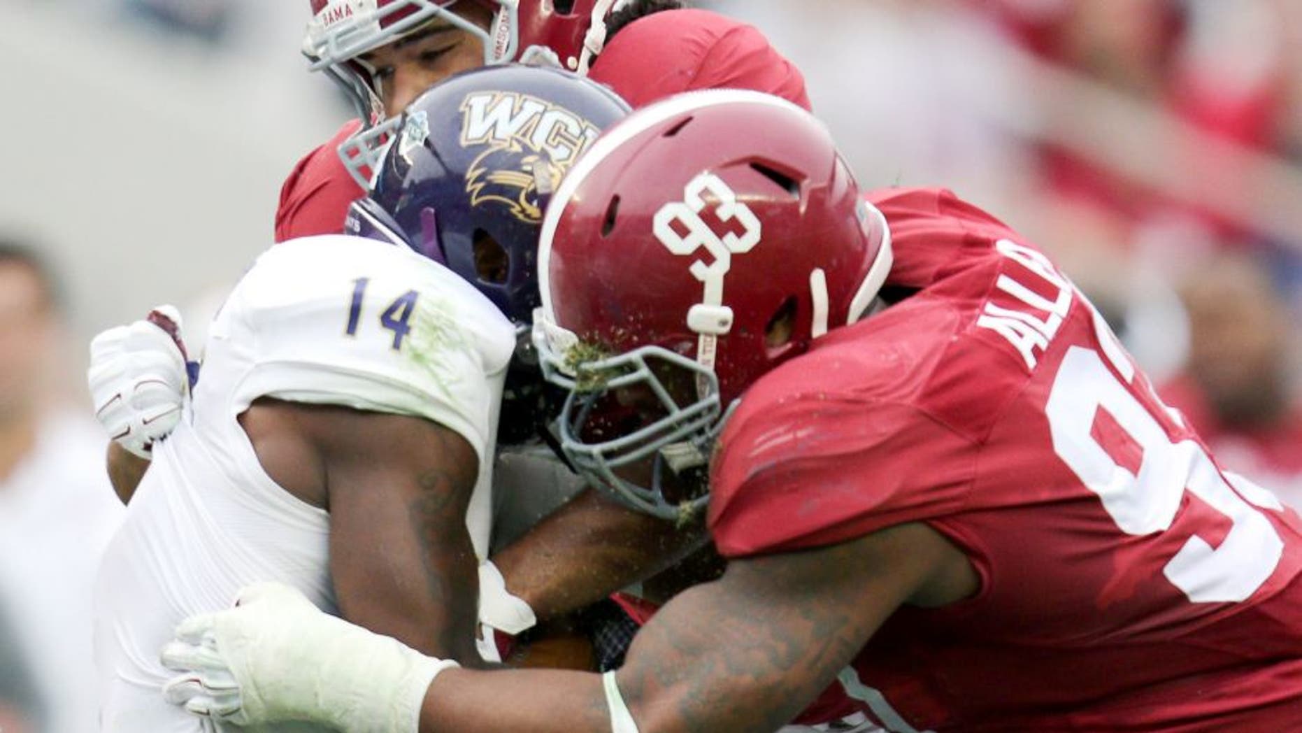 Nov 22, 2014; Tuscaloosa, AL, USA; Alabama Crimson Tide defensive lineman Jonathan Allen (93) and linebacker Trey DePriest (33) wrap up Western Carolina Catamounts wide receiver Karnorris Benson (14) at Bryant-Denny Stadium. Mandatory Credit: Marvin Gentry-USA TODAY Sports