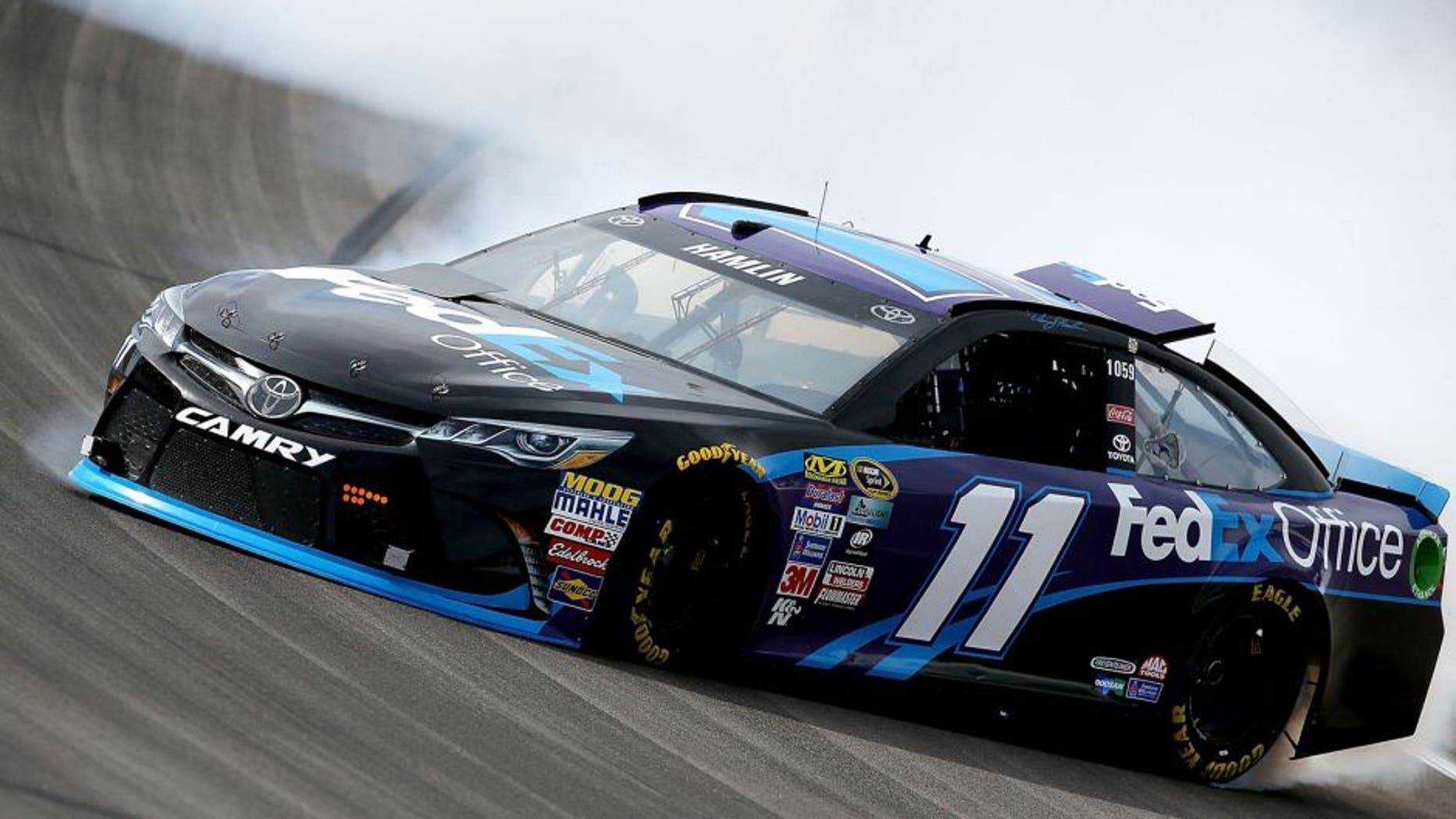 LAS VEGAS, NV - MARCH 03: Denny Hamlin, driver of the #11 FedEx Office Toyota, spins out during Testing at Las Vegas Motor Speedway on March 3, 2016 in Las Vegas, Nevada. (Photo by Sean Gardner/NASCAR via Getty Images)