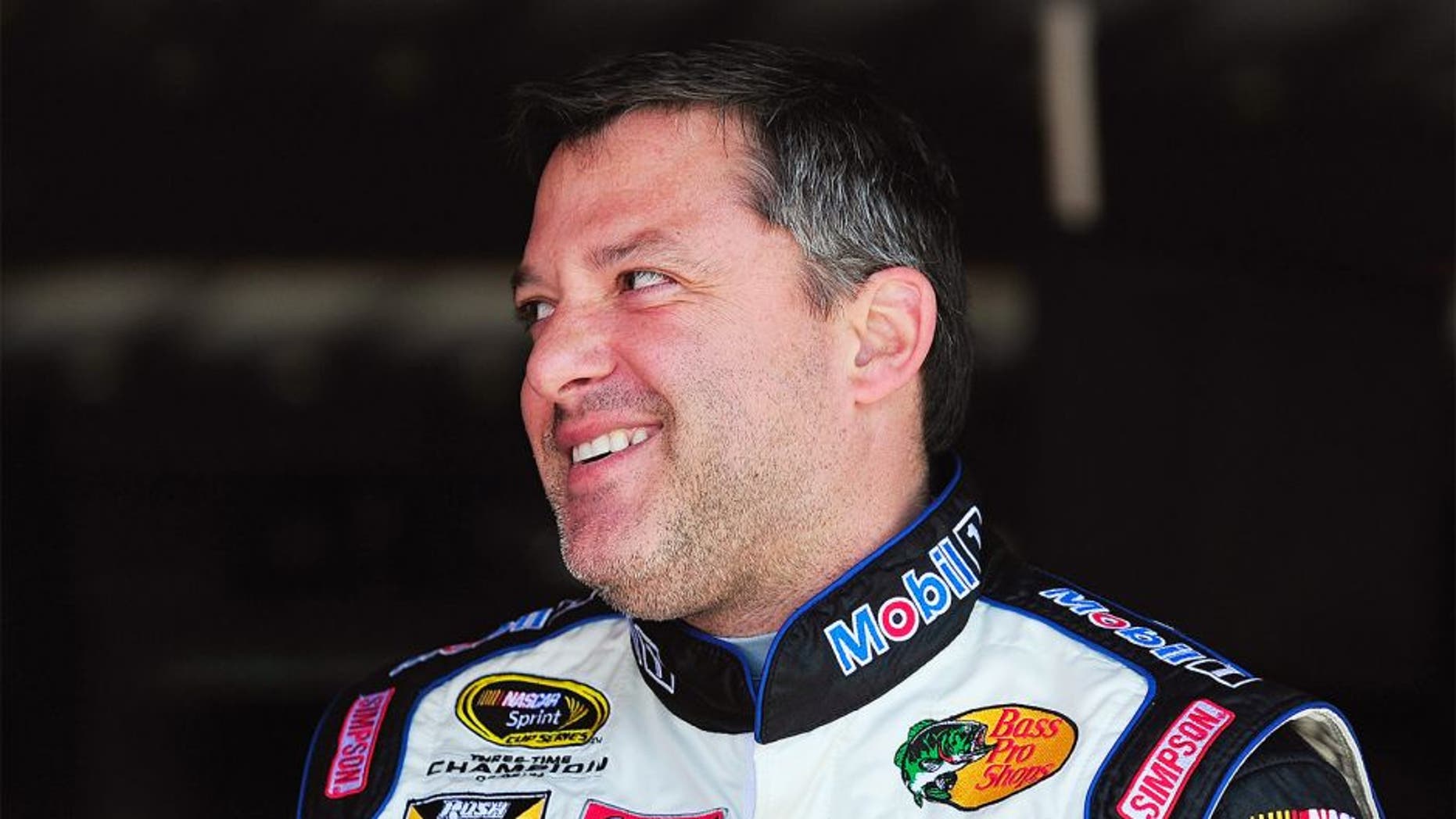 RICHMOND, VA - APRIL 24: Tony Stewart, driver of the #14 Mobil 1 / Bass Pro Shops Chevrolet, stands in the garage area during practice for the NASCAR Sprint Cup Series Toyota Owners 400 at Richmond International Raceway on April 24, 2015 in Richmond, Virginia. (Photo by Jeff Curry/Getty Images)