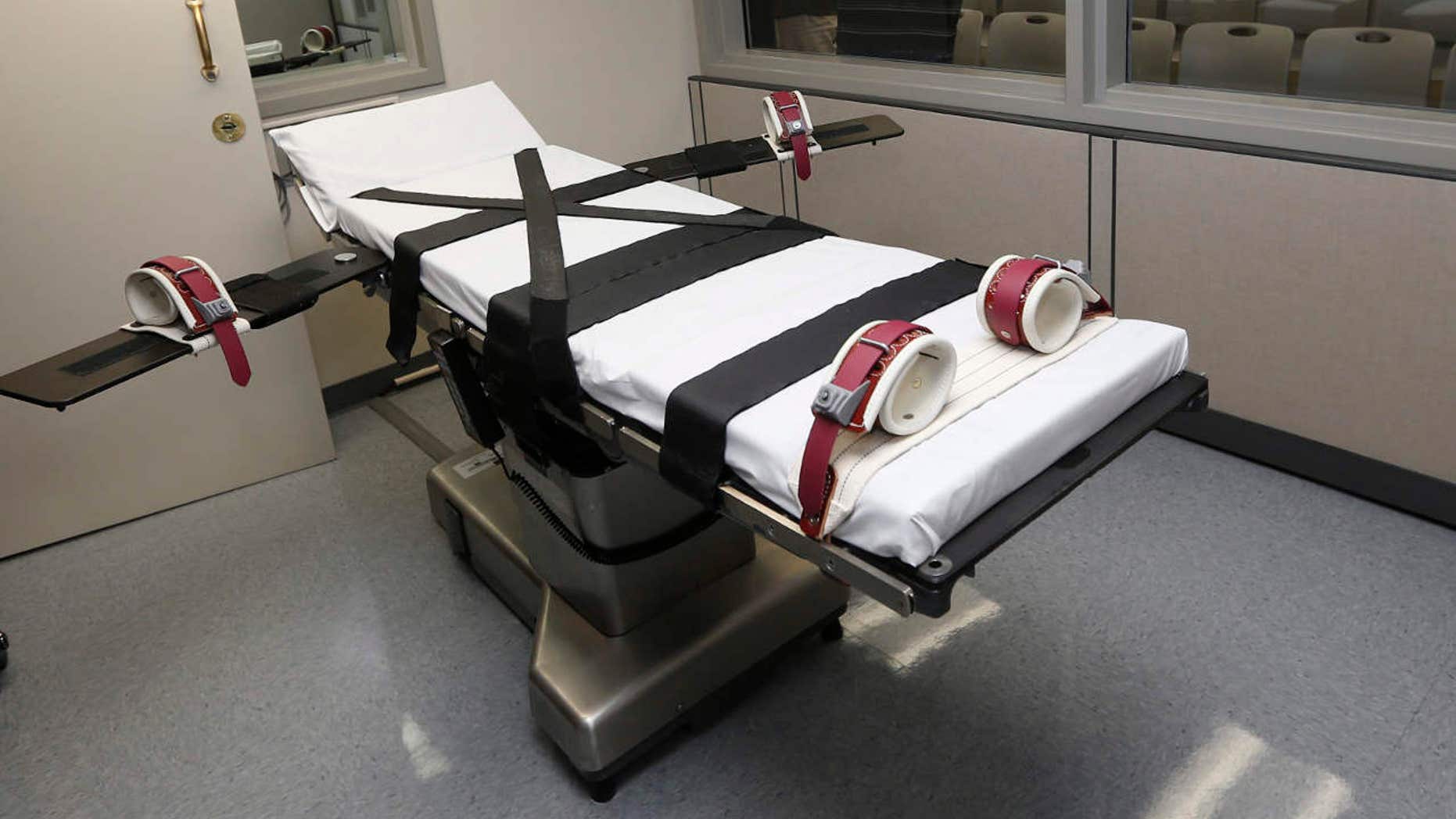 FILE - This Oct. 9, 2014, file photo shows the gurney in the the execution chamber at the Oklahoma State Penitentiary in McAlester, Okla.