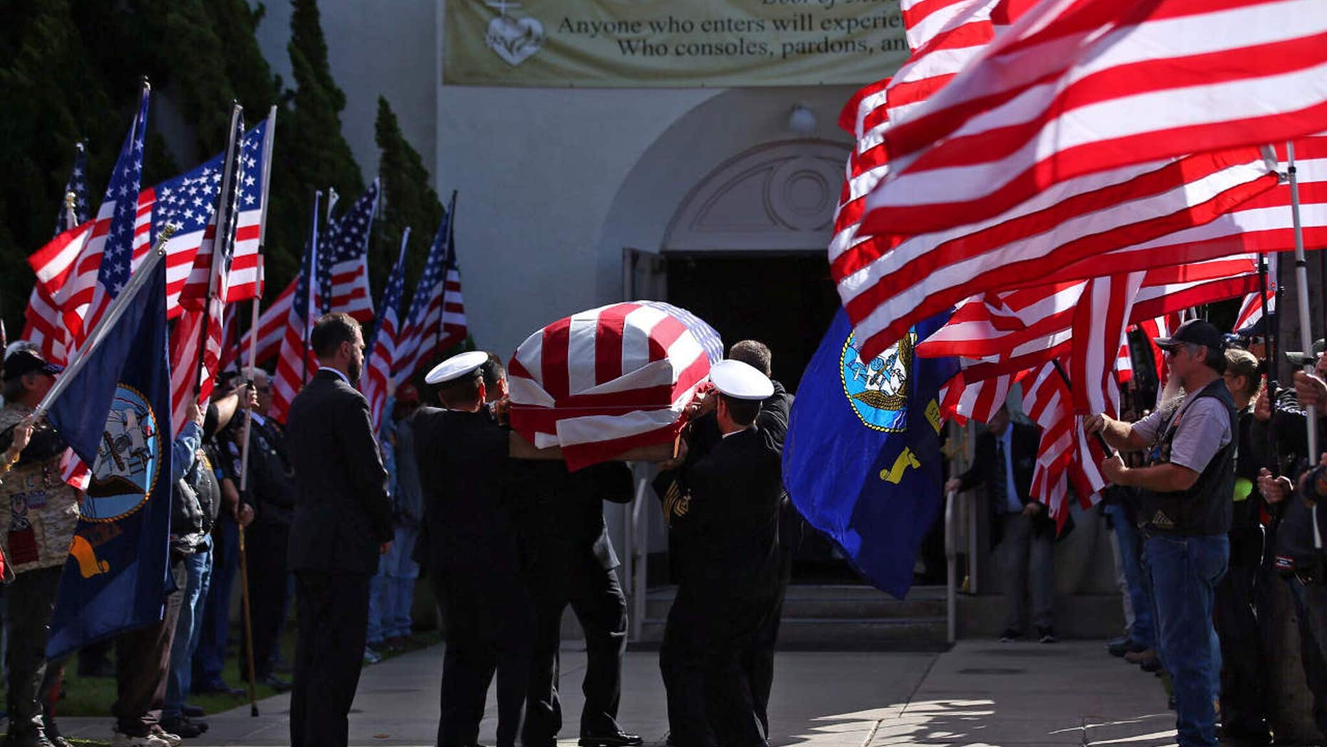Nov. 1, 2016: The funeral begins for Coronado-based Chief Petty Officer Jason C. Finan, 34, of Anaheim, as his casket is carried into church in Coronado, Calif.