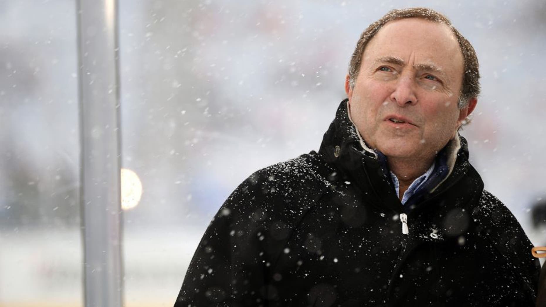 ANN ARBOR, MI - JANUARY 1: (EDITORIAL USE ONLY) NHL Commissioner Gary Bettman checks out the snow prior to the 2014 Bridgestone NHL Winter Classic on January 1, 2014 at Michigan Stadium in Ann Arbor, Michigan. (Photo by Jamie Sabau/Getty Images)