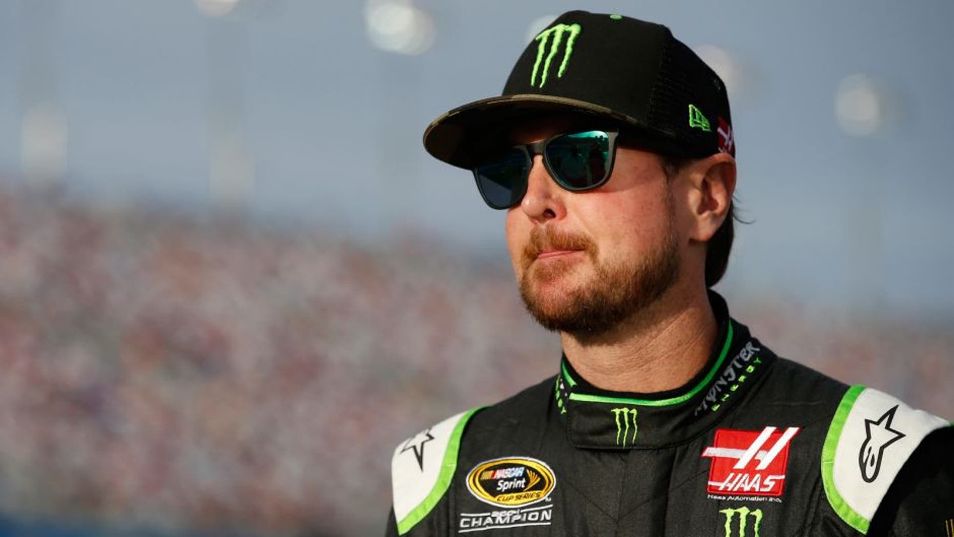 LAS VEGAS, NV - MARCH 04: Kurt Busch, driver of the #41 Monster Energy / Haas Automation Chevrolet stands on the grid during qualifying for the NASCAR Sprint Cup Series Kobalt 400 at Las Vegas Motor Speedway on March 4, 2016 in Las Vegas, Nevada. (Photo by Todd Warshaw/Getty Images)