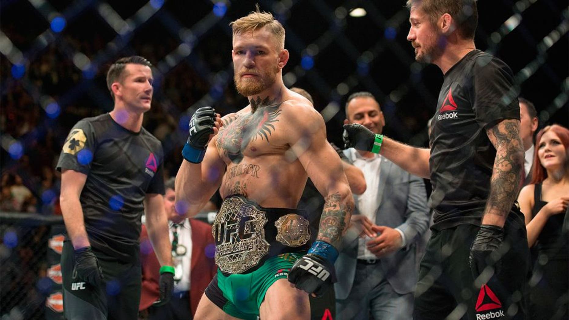 LAS VEGAS, NV - DECEMBER 12: UFC featherweight champion Conor McGregor celebrates his 13 second knockout victory over Jose Aldo in their featherweight championship fight during the UFC 194 event inside MGM Grand Garden Arena on December 12, 2015 in Las Vegas, Nevada. (Photo by Brandon Magnus/Zuffa LLC/Zuffa LLC via Getty Images)