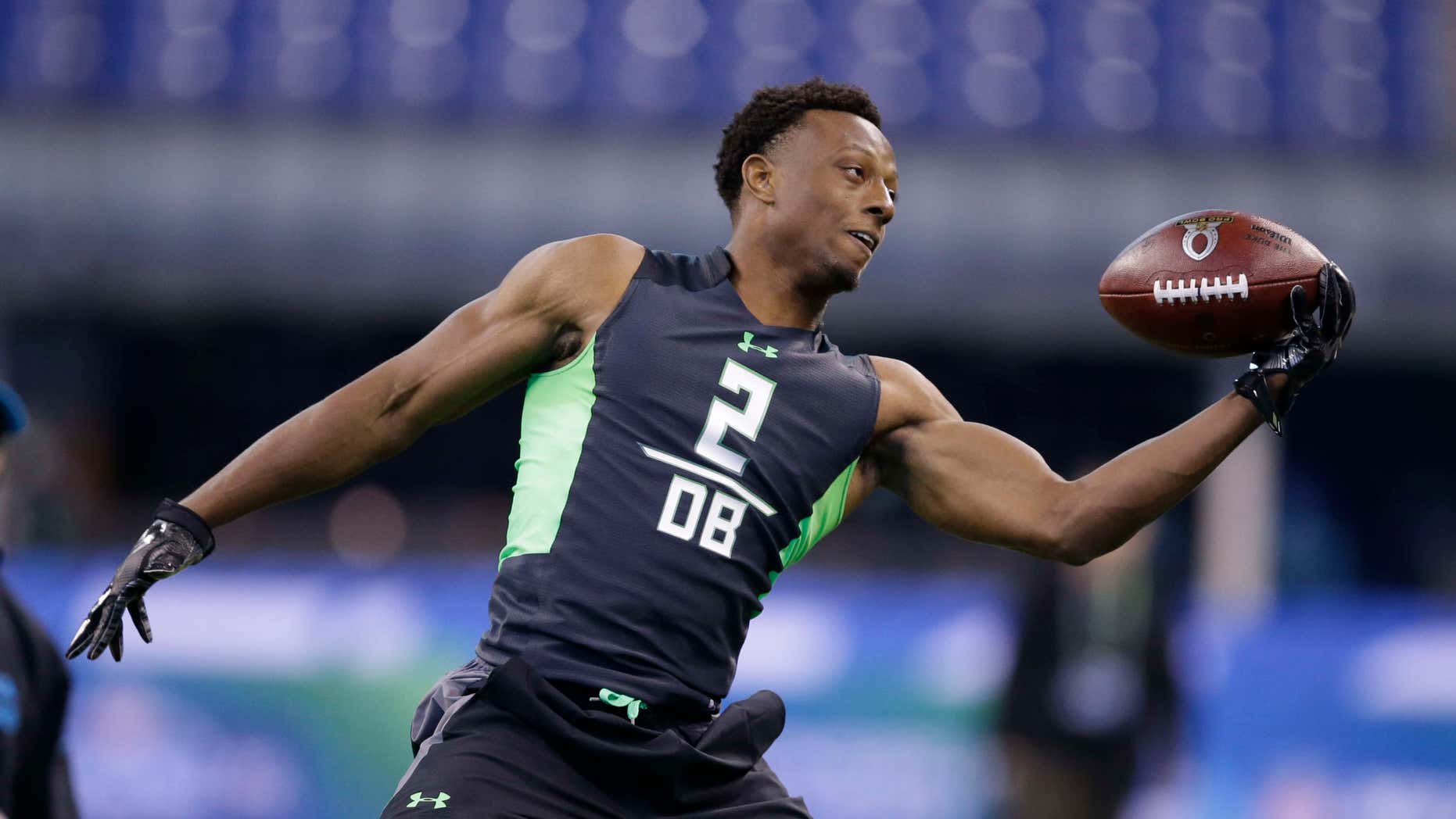 In this Feb. 29, 2016, file photo, Ohio State defensive back Eli Apple runs a drill at the NFL football scouting combine in Indianapolis.