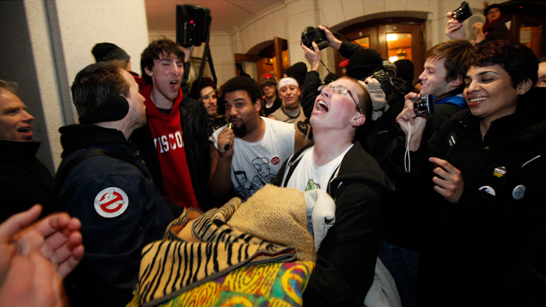 March 3: Protesters celebrate as they walk outside of the state Capitol in Madison, Wis., after a judge ordered the Department of Administration to open the Capitol to normal business hours starting Monday, March 7, 2011.