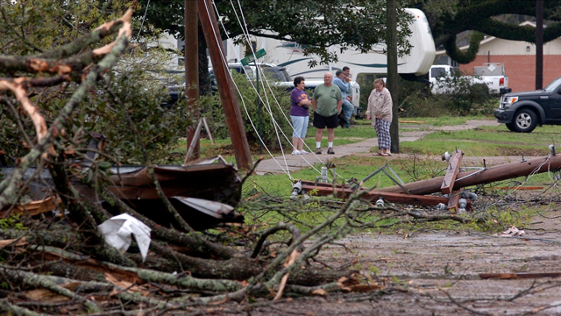 March 5: Residents look at damage from a suspected tornado that injured at least nine people, leveling homes and causing natural gas leaks that prompted evacuations in Rayne, La.
