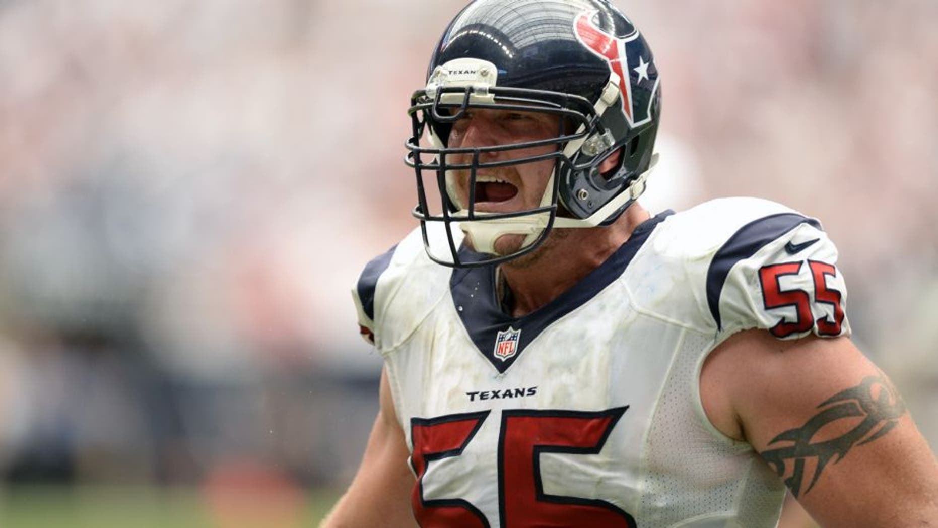 Sep 15, 2013; Houston, TX, USA; Houston Texans center Chris Myers (55) celebrates the winning touchdown against the Tennessee Titans during overtime at Reliant Stadium. The Texans won 30-24. Mandatory Credit: Thomas Campbell-USA TODAY Sports