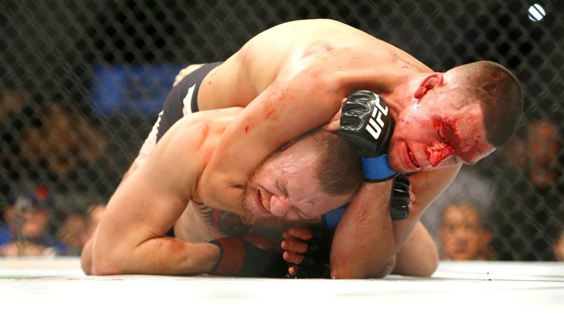 LAS VEGAS, NV - MARCH 5: Nate Diaz applies a choke hold to win by submission against Conor McGregor during UFC 196 at the MGM Grand Garden Arena on March 5, 2016 in Las Vegas, Nevada. (Photo by Rey Del Rio/Getty Images)