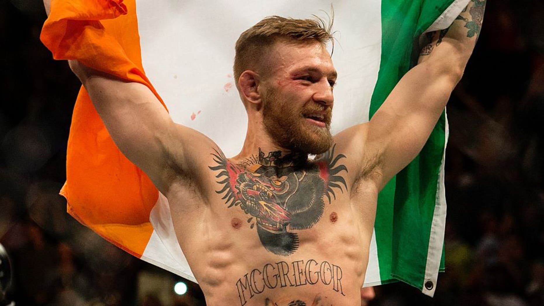 LAS VEGAS, NV - DECEMBER 12: UFC featherweight champion Conor McGregor celebrates his 13 second knockout victory over Jose Aldo in their featherweight championship fight during the UFC 194 event inside MGM Grand Garden Arena on December 12, 2015 in Las Vegas, Nevada. (Photo by Brandon Magnus/Zuffa LLC/Zuffa LLC via Getty Images)