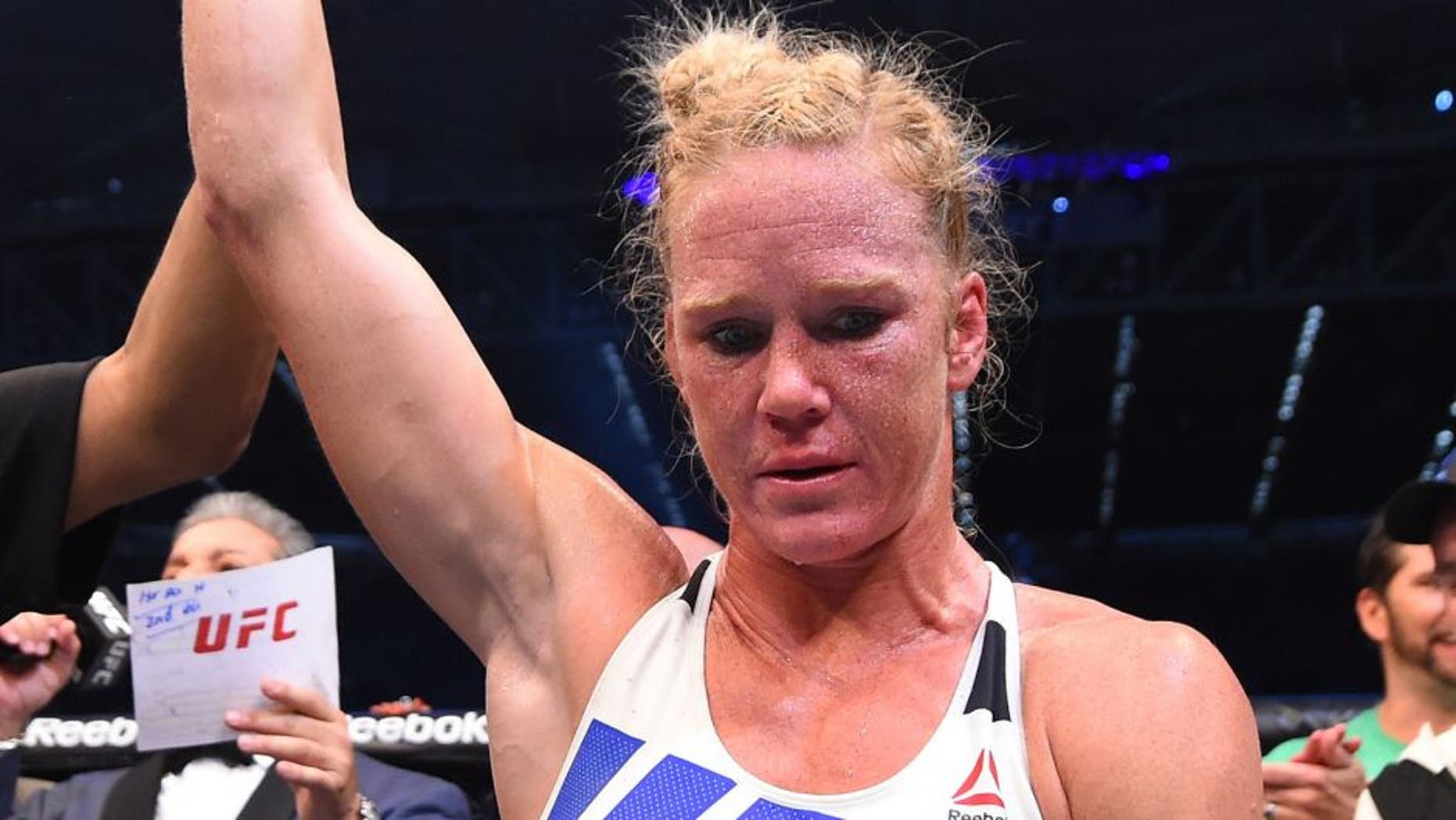 MELBOURNE, AUSTRALIA - NOVEMBER 15: Holly Holm of the United States celebrates after her knockout victory over Ronda Rousey of the United States in their UFC women's bantamweight championship bout during the UFC 193 event at Etihad Stadium on November 15, 2015 in Melbourne, Australia. (Photo by Josh Hedges/Zuffa LLC/Zuffa LLC via Getty Images)