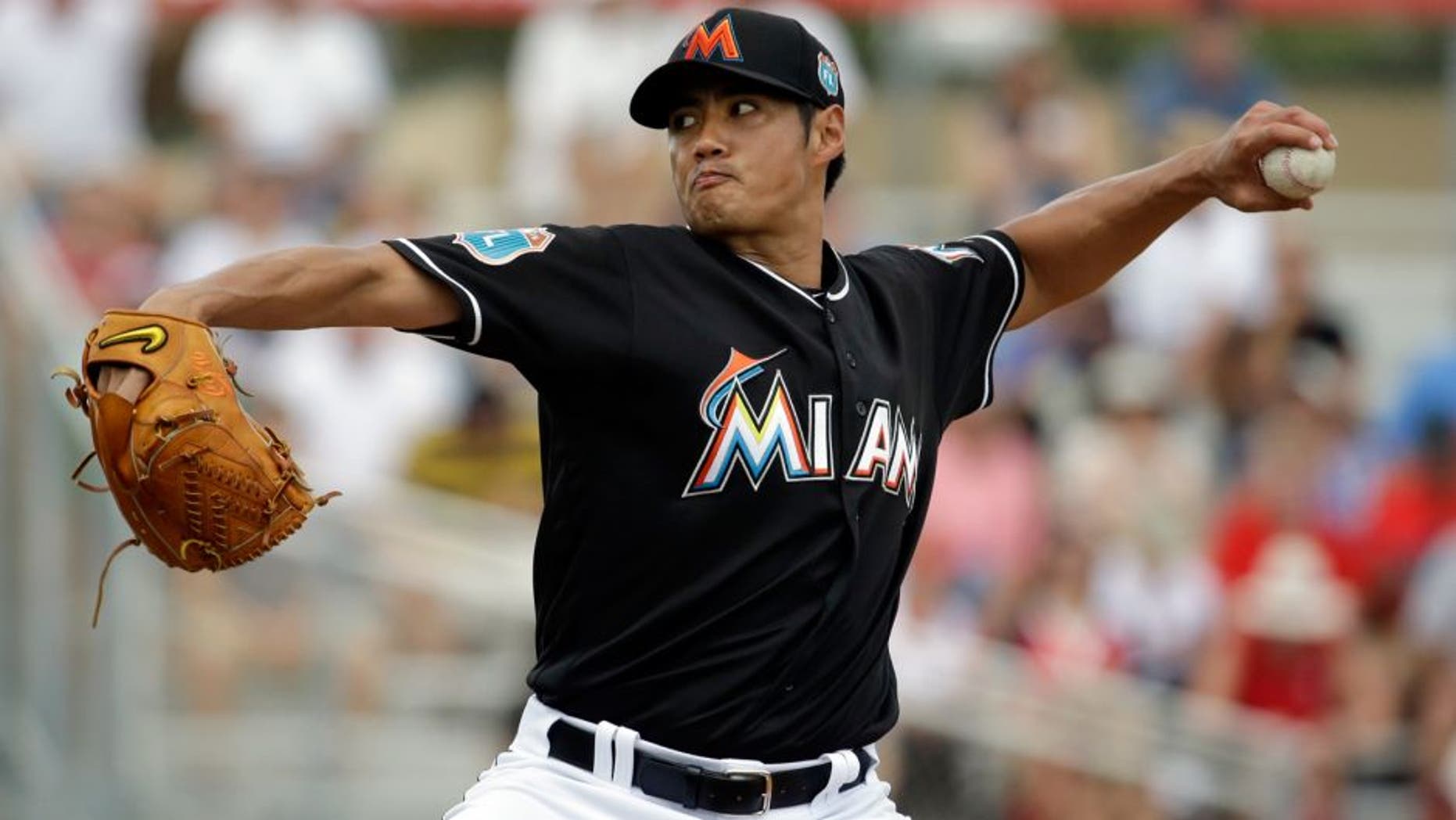 Miami Marlins starting pitcher Wei-Yin Chen throws during the first inning of an exhibition spring training baseball game against the St. Louis Cardinals Saturday, March 5, 2016, in Jupiter, Fla. (AP Photo/Jeff Roberson)