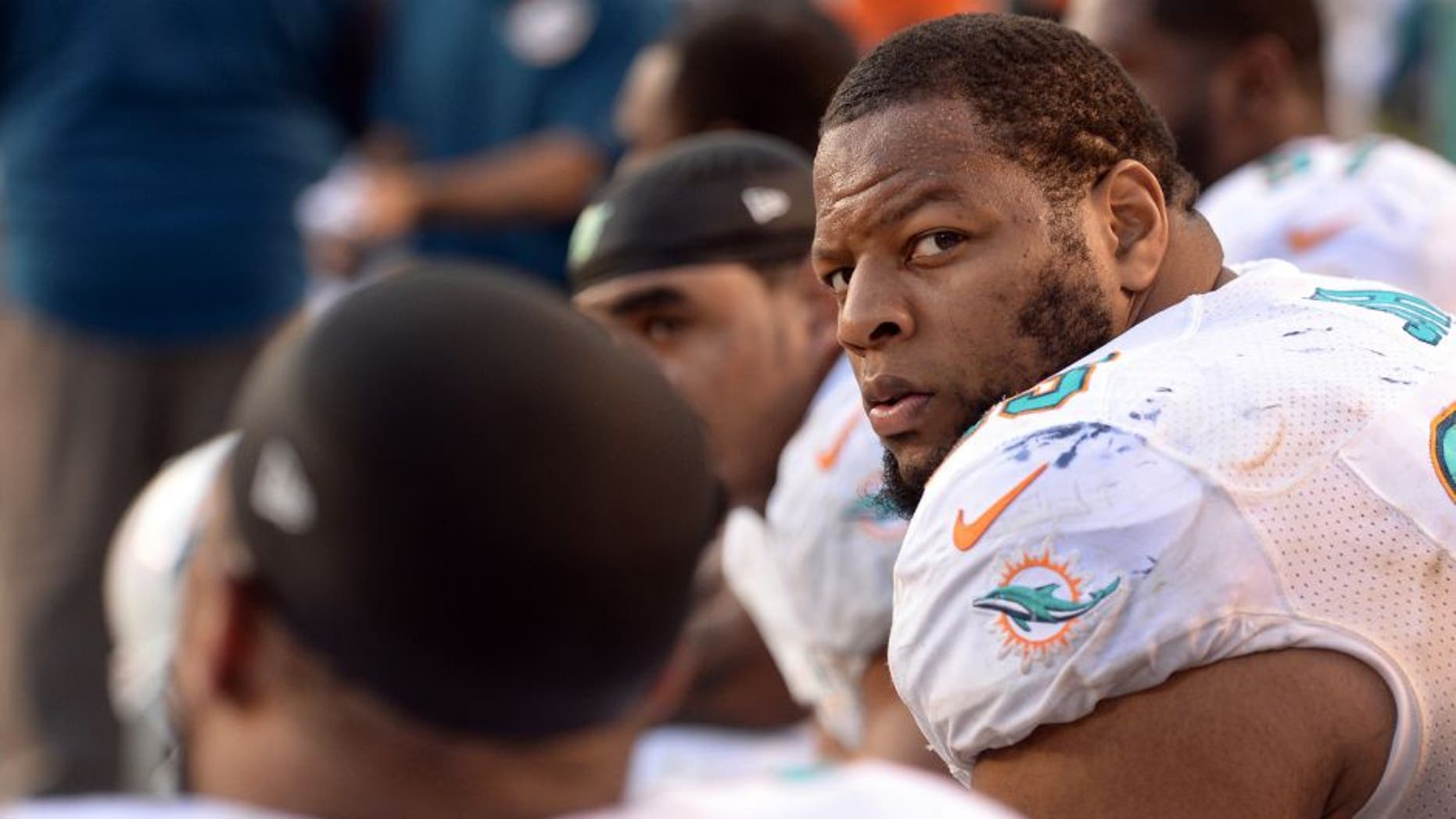 Dec 20, 2015; San Diego, CA, USA; Miami Dolphins defensive tackle Ndamukong Suh (93) looks on from the bench during the fourth quarter against the San Diego Chargers at Qualcomm Stadium. Mandatory Credit: Jake Roth-USA TODAY Sports