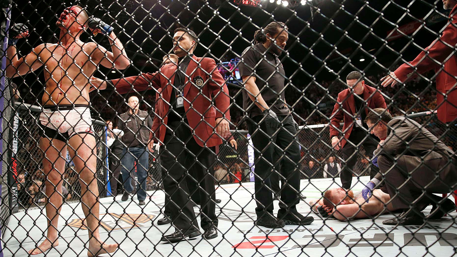 Nate Diaz, left, celebrates his second-round submission victory over Conor McGregor during their UFC 196 welterweight mixed martial arts match Saturday, March 5, 2016, in Las Vegas.