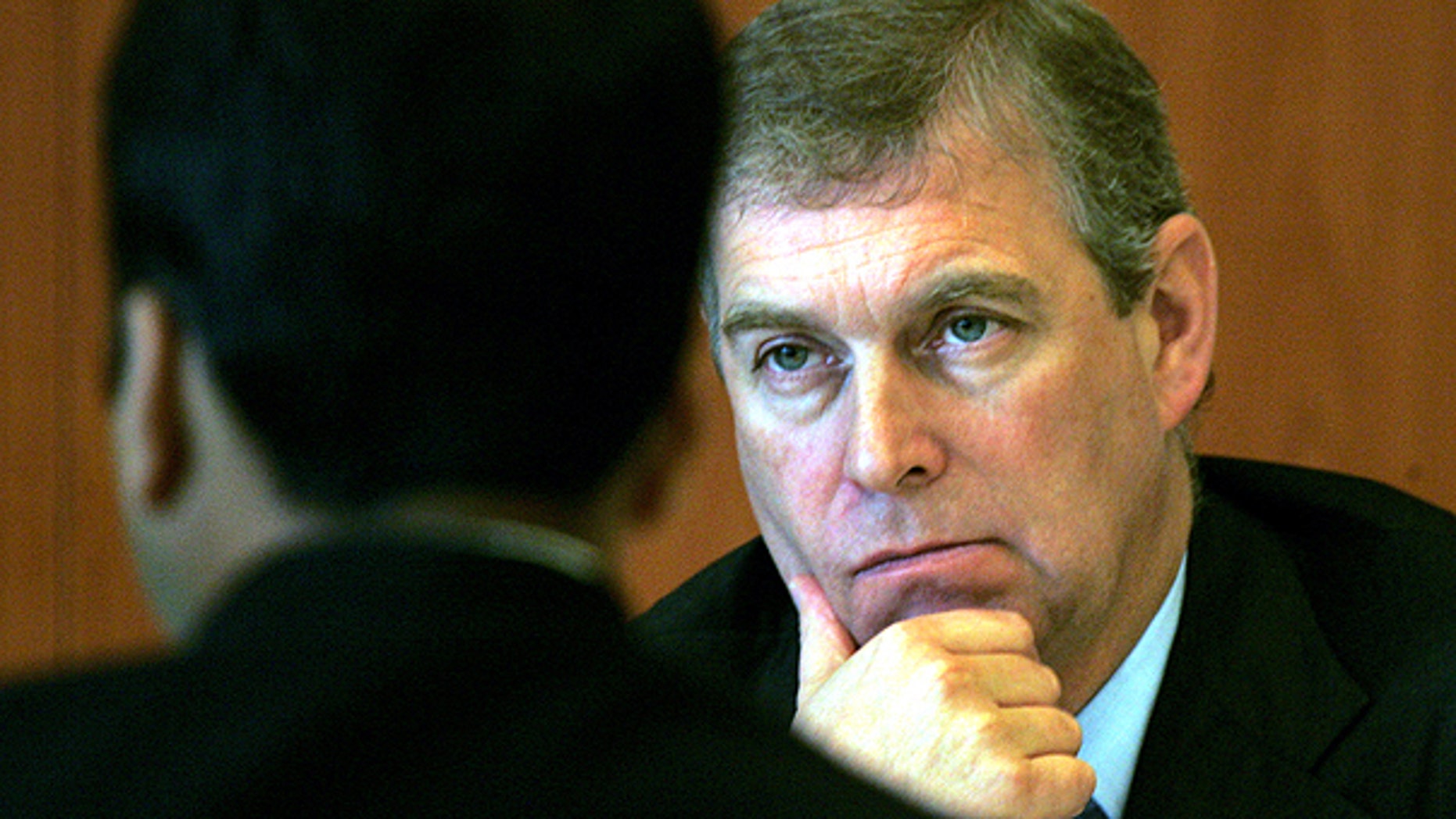 In this Monday, Oct. 30, 2006 file photo Prince Andrew, The Duke of York and U.K. Special Representative for International Trade and Investment, gestures during a luncheon session in his honor, organized by Indian Chambers of Commerce and Industries in New Delhi, India.
