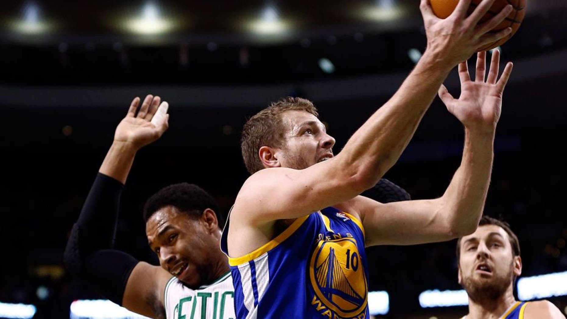 Mar 5, 2014; Boston, MA, USA; Golden State Warriors power forward David Lee (10) shoots the ball against Boston Celtics center Jared Sullinger (7) during the first half at TD Garden. Mandatory Credit: Mark L. Baer-USA TODAY Sports