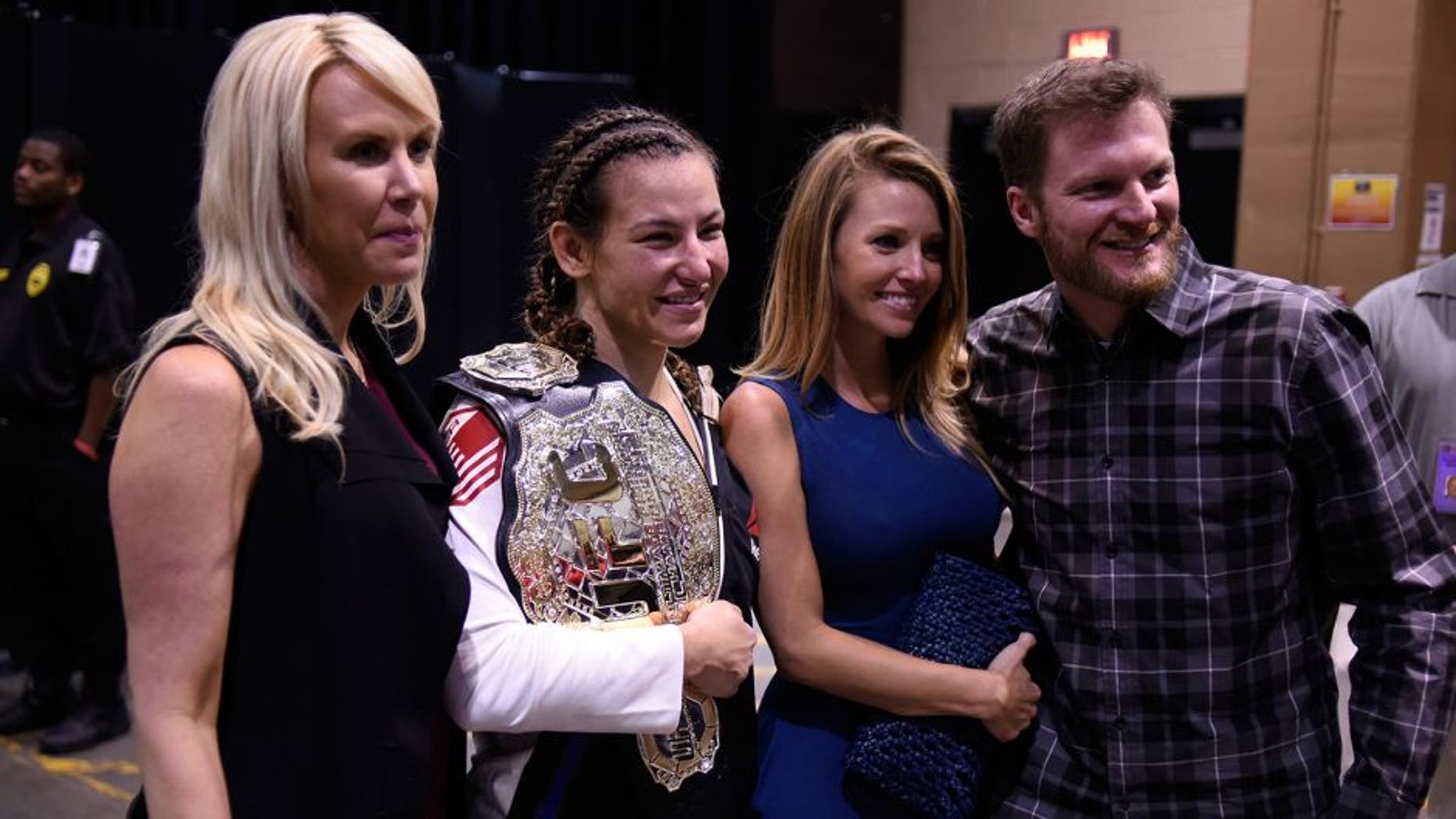 LAS VEGAS, NV - MARCH 05: (L-R) DeLana Harvick, Miesha Tate, Amy Reimann and NASCAR driver Dale Earnhardt, Jr. backstage during the UFC 196 event inside MGM Grand Garden Arena on March 5, 2016 in Las Vegas, Nevada. (Photo by Todd Lussier/Zuffa LLC/Zuffa LLC via Getty Images)