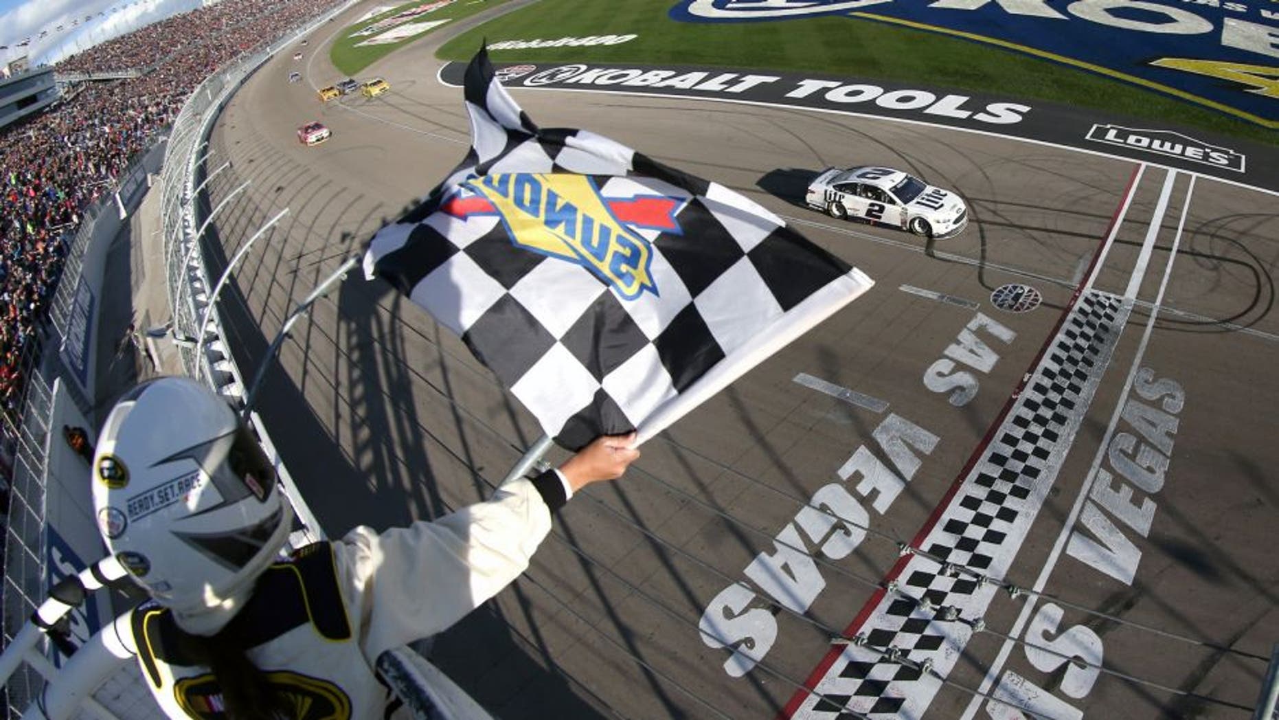 LAS VEGAS, NV - MARCH 06: Brad Keselowski, driver of the #2 Miller Lite Ford, crosses the finish line to win the NASCAR Sprint Cup Series Kobalt 400 at Las Vegas Motor Speedway on March 6, 2016 in Las Vegas, Nevada. (Photo by Sean Gardner/NASCAR via Getty Images)