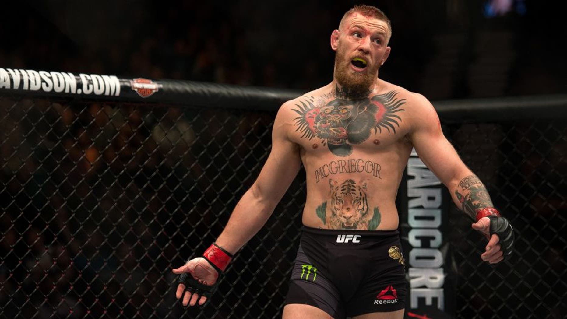 LAS VEGAS, NV - MARCH 5: Conor McGregor mocks Nate Diaz in their welterweight bout during the UFC 196 in the MGM Grand Garden Arena on March 5, 2016 in Las Vegas, Nevada. (Photo by Brandon Magnus/Zuffa LLC/Zuffa LLC via Getty Images)