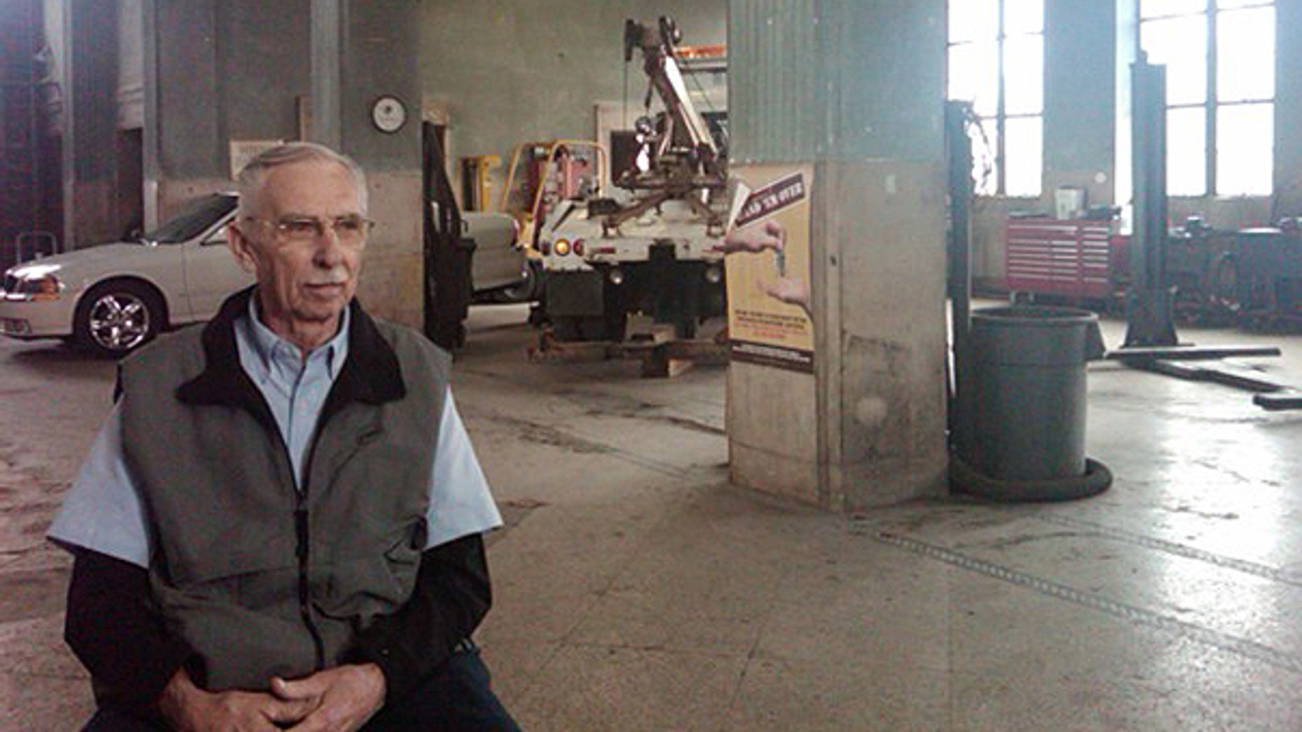 Harvey Davis in his train depot/auto repair shop.