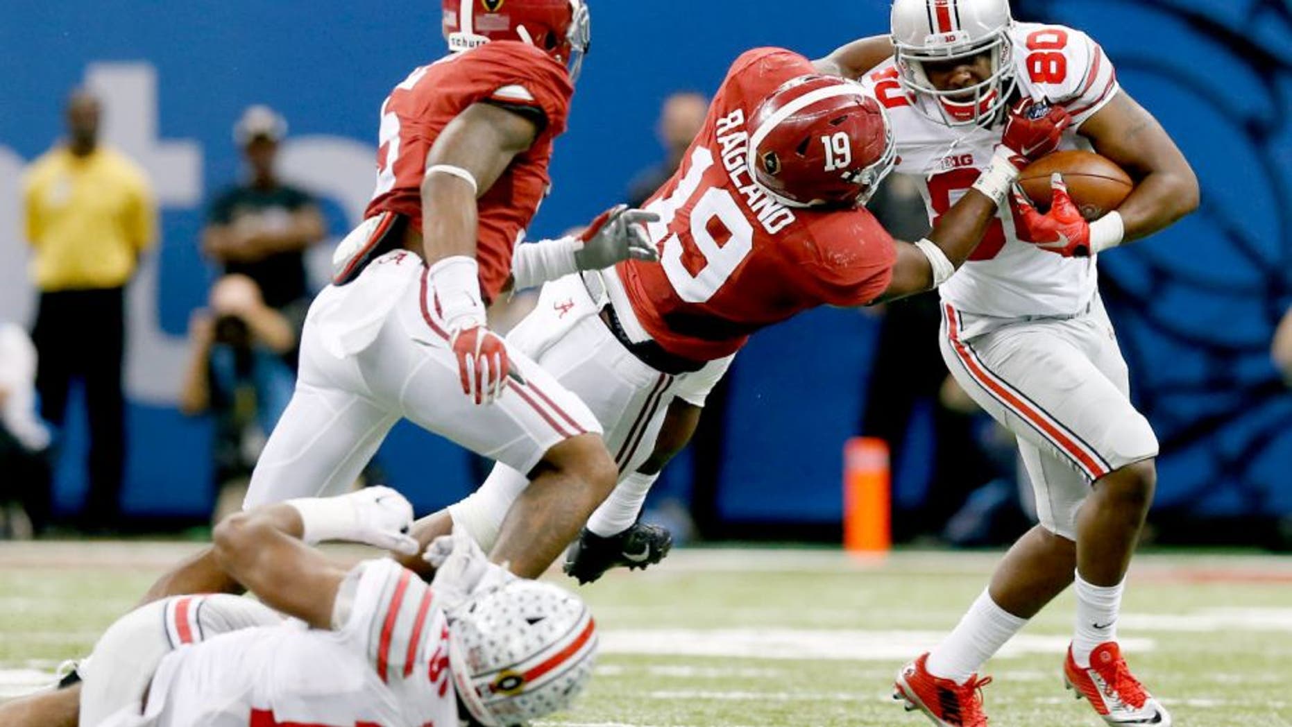 Jan 1, 2015; New Orleans, LA, USA; Ohio State Buckeyes halfback Noah Brown (80) runs with the ball against Alabama Crimson Tide linebacker Reggie Ragland (19) in the 2015 Sugar Bowl at Mercedes-Benz Superdome. The Buckeyes beat the Crimson Tide 42-35. Mandatory Credit: Matthew Emmons-USA TODAY Sports