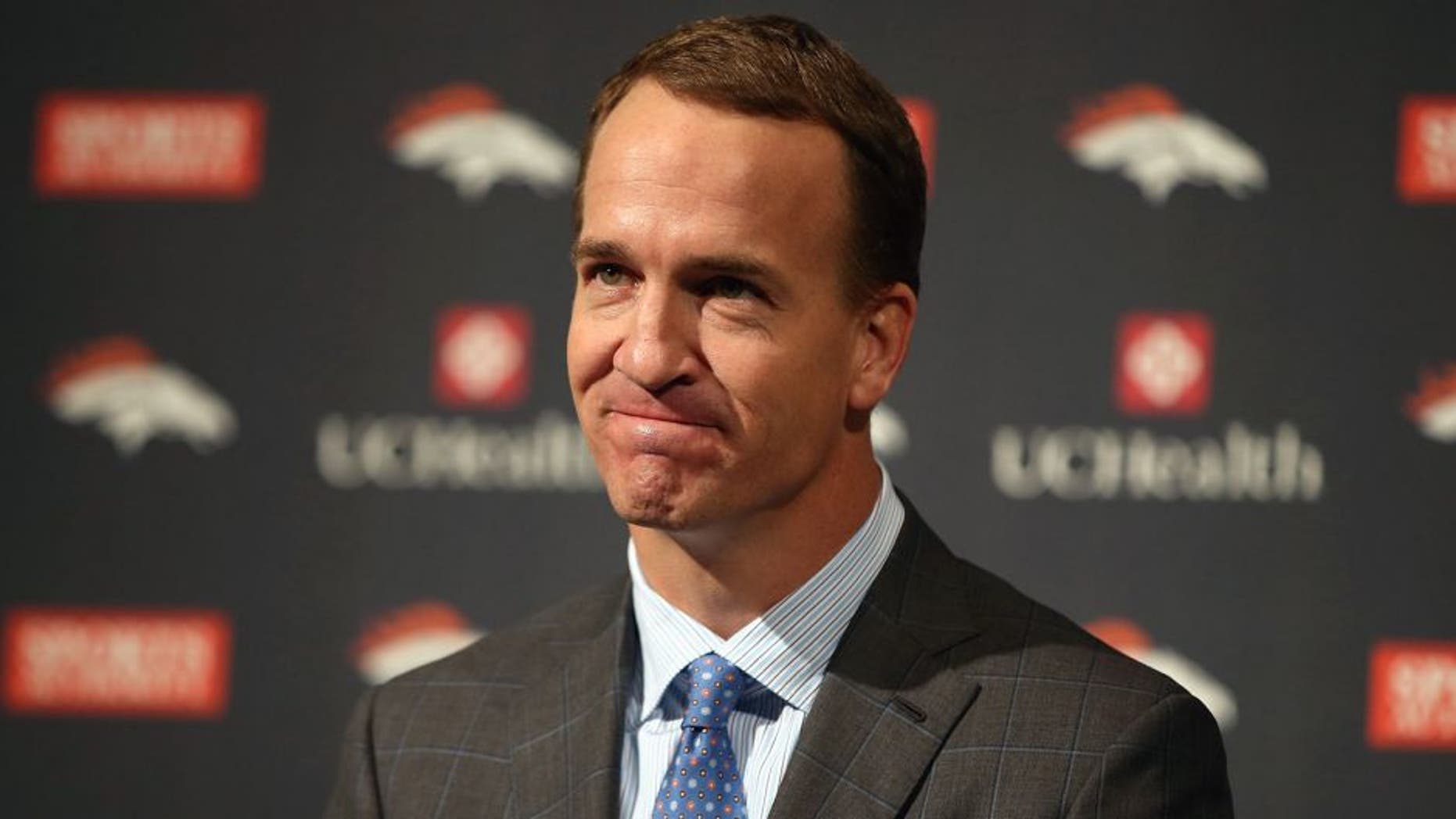 ENGLEWOOD, CO - MARCH 07: Quarterback Peyton Manning reacts as he announces his retirement from the NFL at the UCHealth Training Center on March 7, 2016 in Englewood, Colorado. Manning, who played for both the Indianapolis Colts and Denver Broncos in a career which spanned 18 years, is the NFL's all-time leader in passing touchdowns (539), passing yards (71,940) and tied for regular season QB wins (186). Manning played his final game last month as the winning quarterback in Super Bowl 50 in which the Broncos defeated the Carolina Panthers, earning Manning his second Super Bowl title. (Photo by Doug Pensinger/Getty Images)