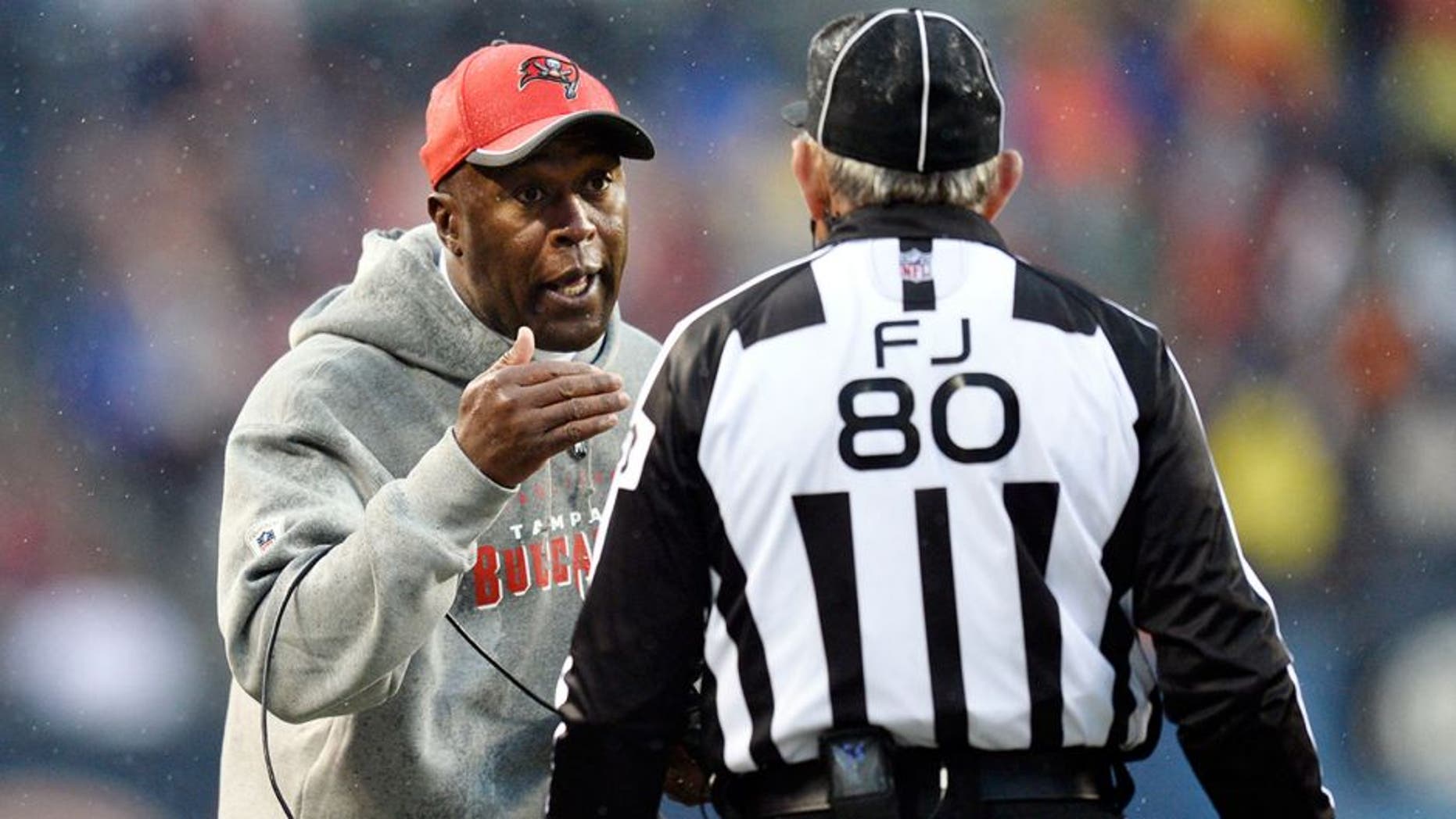 CHICAGO, IL - NOVEMBER 23: Head coach Lovie Smith of the Tampa Bay Buccaneers (L) talks with field judge Greg Gautreaux during the fourth quarter against the Chicago Bears on November 23, 2014 at Soldier Field in Chicago, Illinois. The Bears defeated the Buccaneers 21-13. (Photo by Brian Kersey/Getty Images)