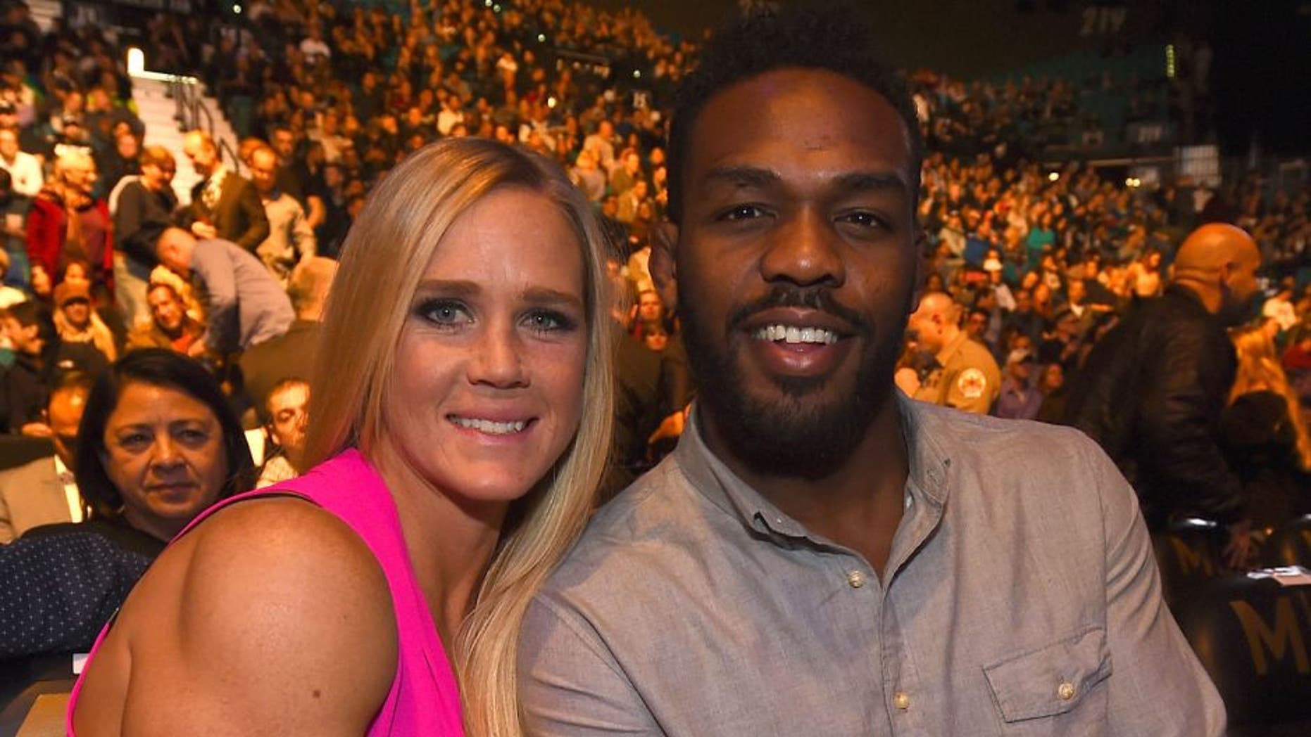 LAS VEGAS, NV - JANUARY 02: (L-R) UFC bantamweight champion Holly Holm and UFC light heavyweight Jon Jones in attendance during the UFC 195 event inside MGM Grand Garden Arena on January 2, 2016 in Las Vegas, Nevada. (Photo by Jeff Bottari/Zuffa LLC/Zuffa LLC via Getty Images)