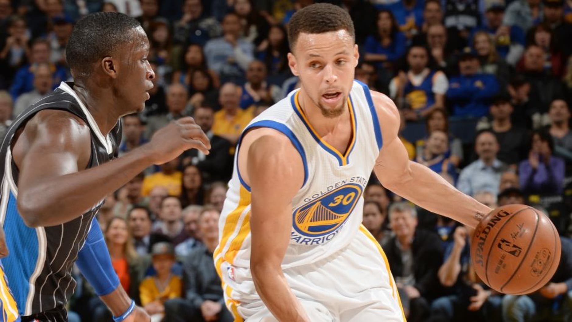 OAKLAND, CA - MARCH 7: Stephen Curry #30 of the Golden State Warriors drives to the basket against the Orlando Magic during the game on March 7, 2016 at ORACLE Arena in Oakland, California. NOTE TO USER: User expressly acknowledges and agrees that, by downloading and or using this photograph, user is consenting to the terms and conditions of Getty Images License Agreement. Mandatory Copyright Notice: Copyright 2016 NBAE (Photo by Noah Graham/NBAE via Getty Images)