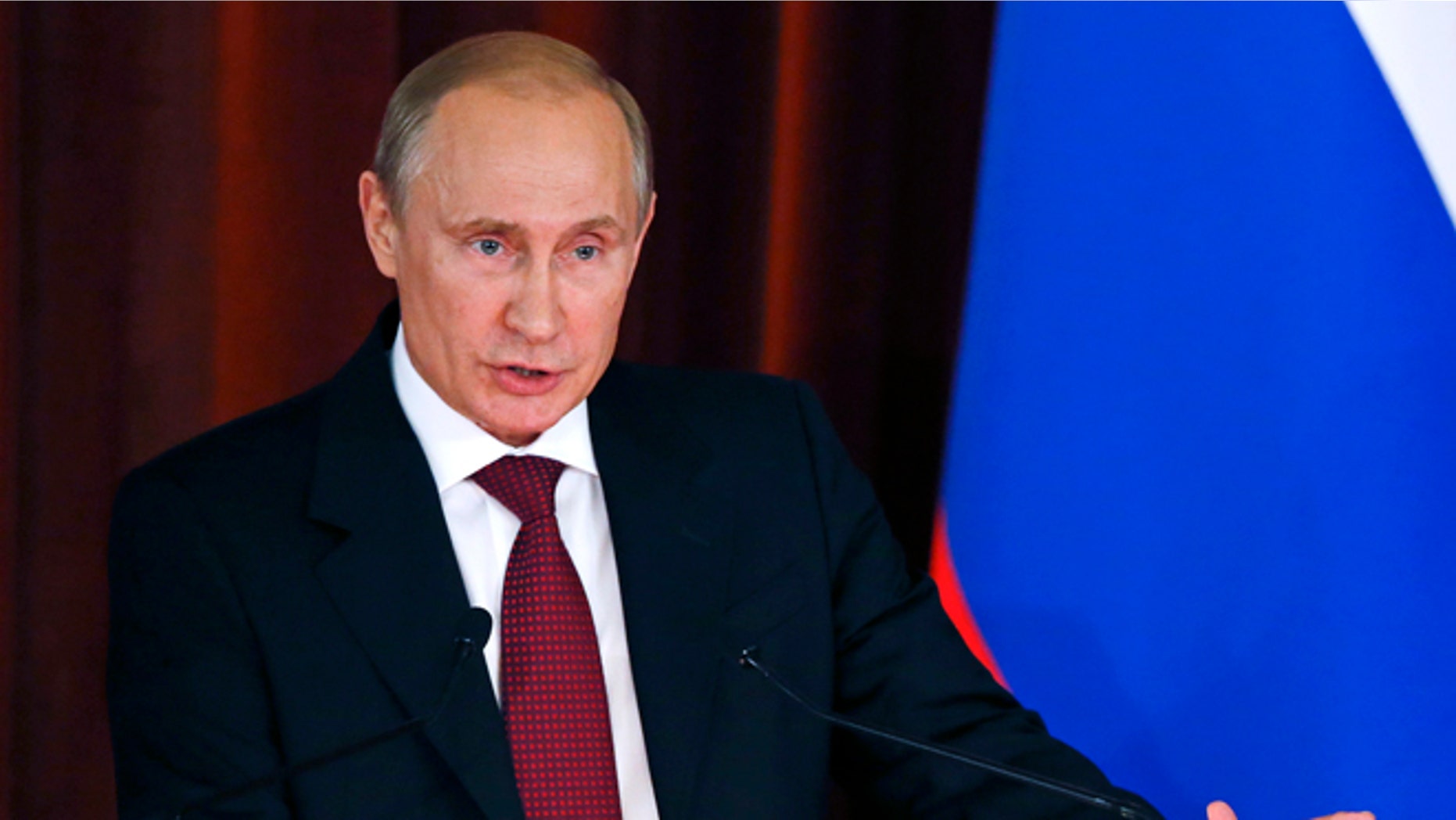 Russian President Vladimir Putin delivers a speech during a meeting with Russian ambassadors, envoys and diplomats at the Foreign Ministry headquarters in Moscow, Tuesday, July 1, 2014. (AP Photo//Maxim Zmeyev, Pool)