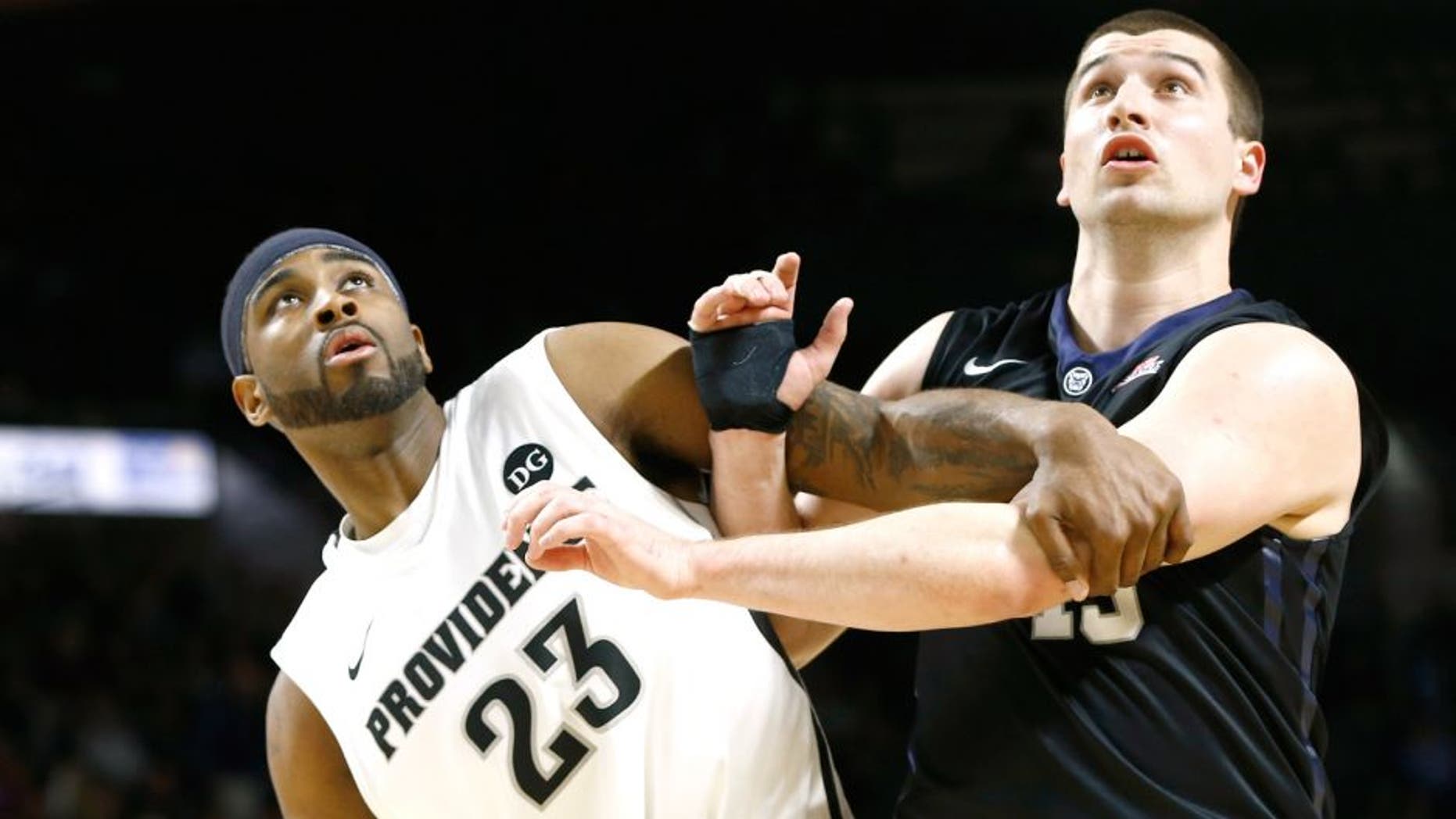 Mar 7, 2015; Providence, RI, USA; Providence Friars forward LaDontae Henton (23) blocks out against Butler Bulldogs forward Andrew Chrabascz (45) during the second half at Dunkin Donuts Center. Mandatory Credit: Mark L. Baer-USA TODAY Sports