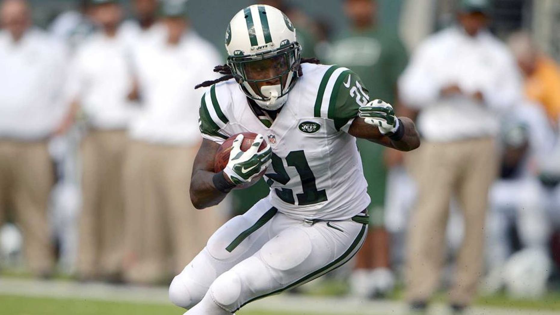 Sep 7, 2014; East Rutherford, NJ, USA; New York Jets running back Chris Johnson (21) carries the ball against the Oakland Raiders at MetLife Stadium. Mandatory Credit: Kirby Lee-USA TODAY Sports