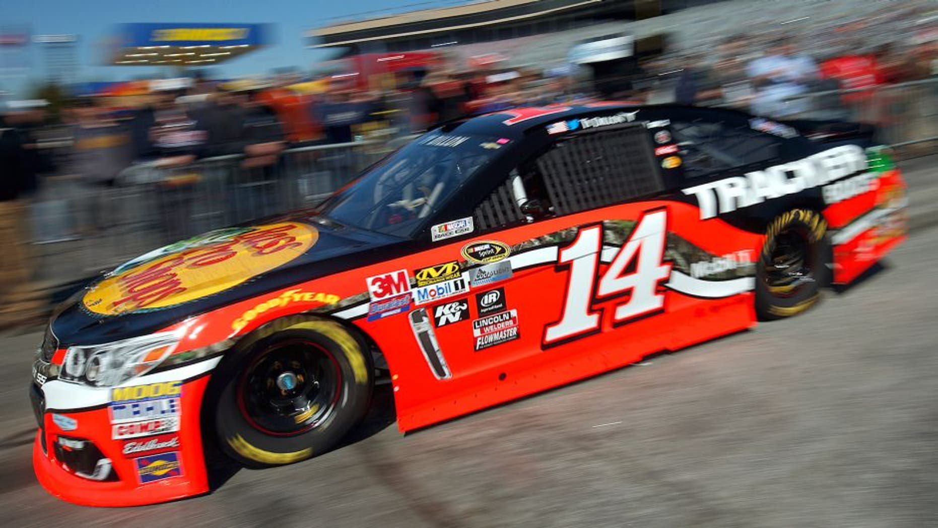 HAMPTON, GA - FEBRUARY 27: Ty Dillon drives the #14 Bass Pro Shops/Tracker Boats Chevrolet through the garage area during practice for the NASCAR Sprint Cup Series Folds of Honor QuikTrip 500 at Atlanta Motor Speedway on February 27, 2016 in Hampton, Georgia. (Photo by Todd Warshaw/NASCAR via Getty Images)