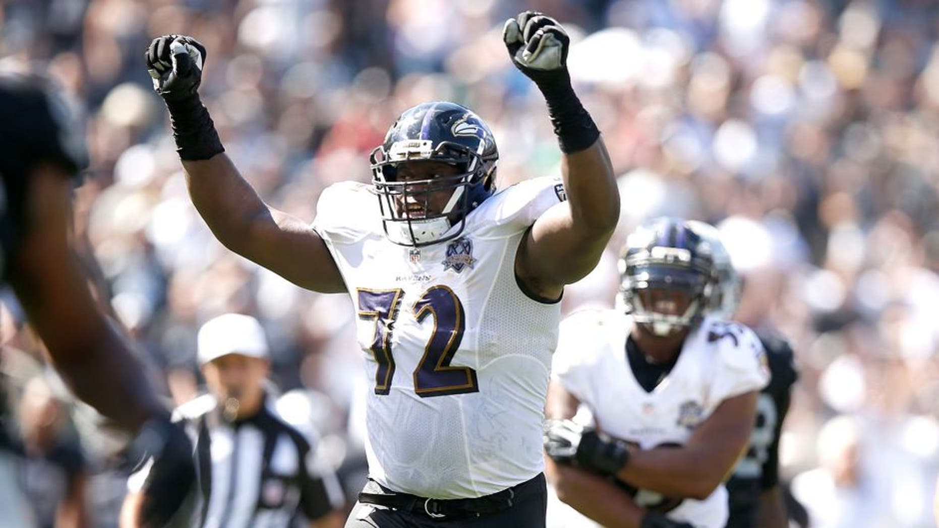 OAKLAND, CA - SEPTEMBER 20: Kelechi Osemele #72 of the Baltimore Ravens celebrates a touchdown in the second quarter against the Oakland Raiders at Oakland-Alameda County Coliseum on September 20, 2015 in Oakland, California. (Photo by Ezra Shaw/Getty Images)
