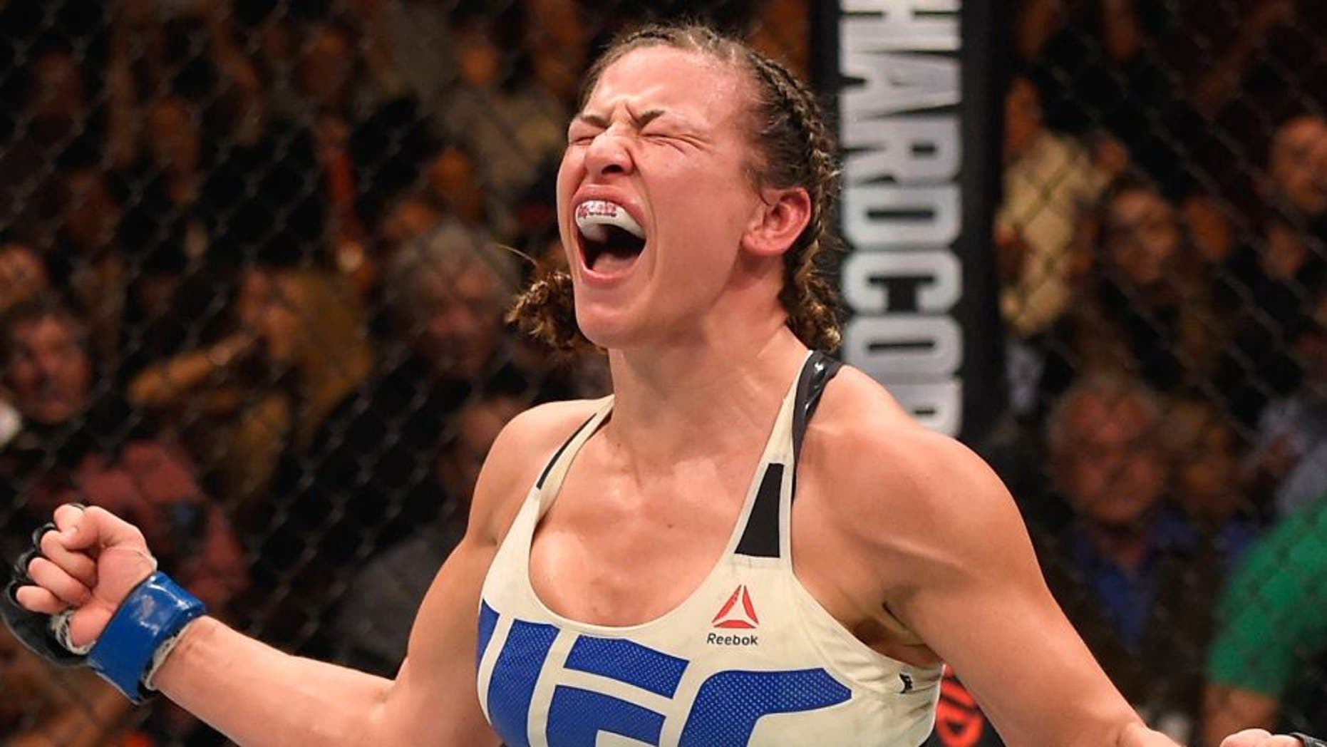 LAS VEGAS, NV - MARCH 05: Miesha Tate reacts after her submission victory over Holly Holm in their UFC women's bantamweight championship bout during the UFC 196 event inside MGM Grand Garden Arena on March 5, 2016 in Las Vegas, Nevada. (Photo by Josh Hedges/Zuffa LLC/Zuffa LLC via Getty Images)