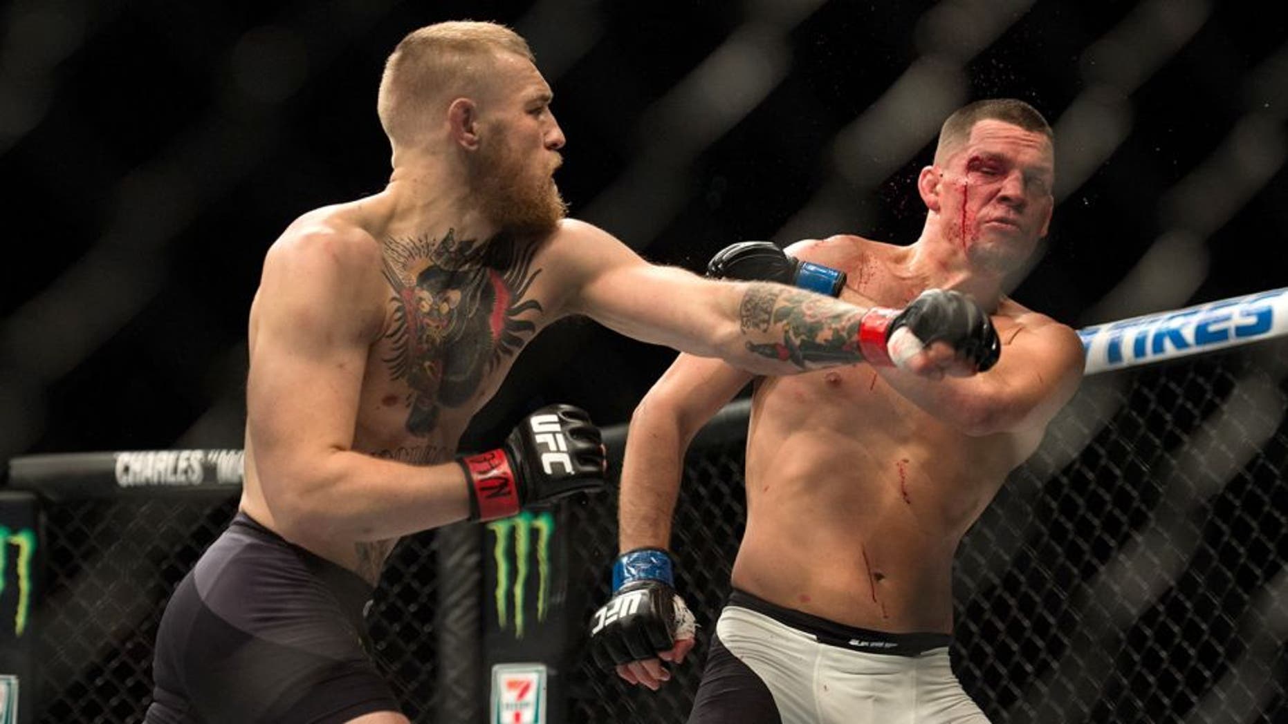 LAS VEGAS, NV - MARCH 5: (L-R) Conor McGregor punches Nate Diaz in their welterweight bout during the UFC 196 in the MGM Grand Garden Arena on March 5, 2016 in Las Vegas, Nevada. (Photo by Brandon Magnus/Zuffa LLC/Zuffa LLC via Getty Images)
