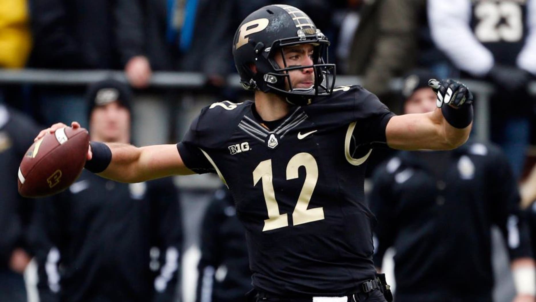 Nov 28, 2015; West Lafayette, IN, USA; Purdue Boilermakers quarterback Austin Appleby (12) throws a pass against the Indiana Hoosiers at Ross Ade Stadium. Indiana defeats Purdue 54-36. Mandatory Credit: Brian Spurlock-USA TODAY Sports