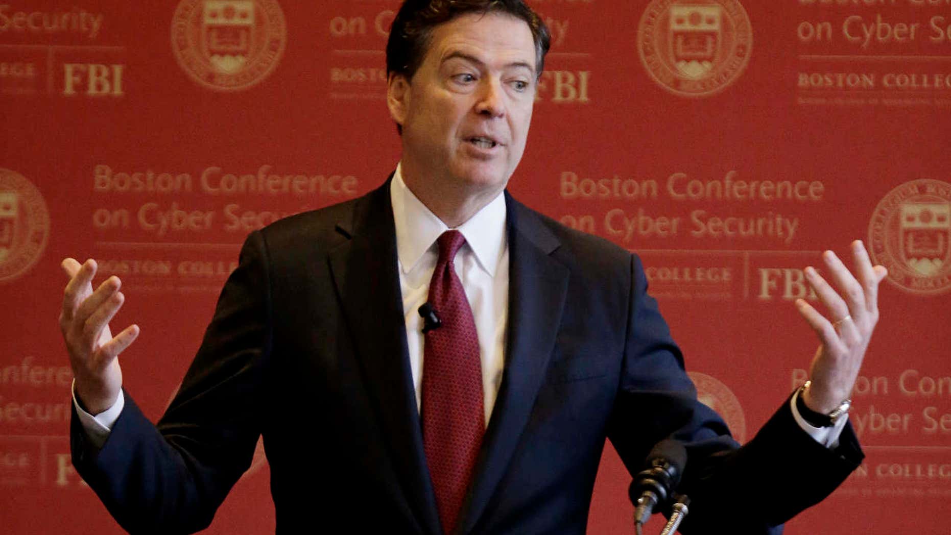 FBI Director James Comey gestures as he speaks on cyber security at the first Boston Conference of Cyber Security at Boston College, Wednesday, March 8, 2017, in Boston.