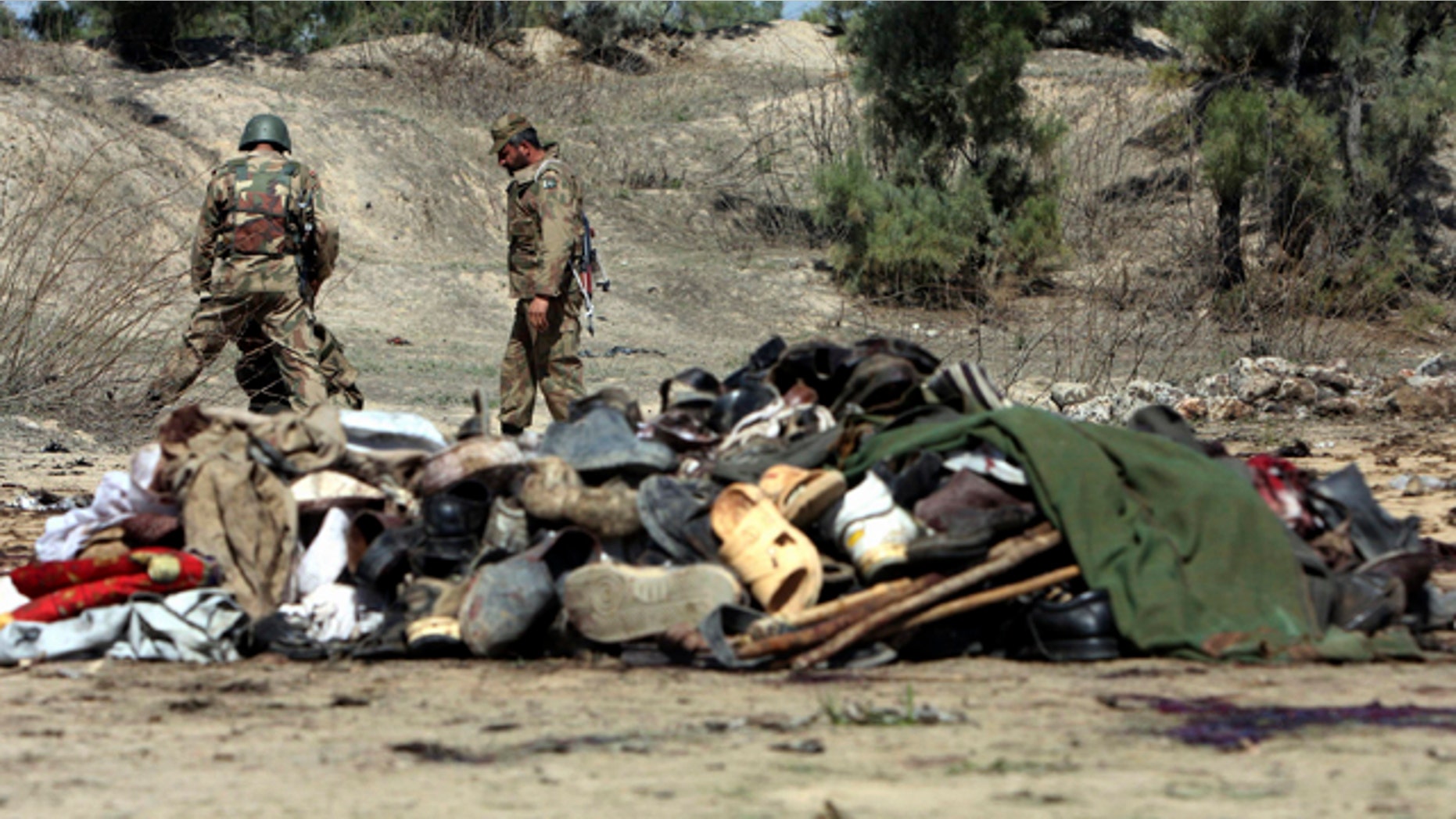 March 9: Pakistani army soldiers look for evidence at the site of bomb blast in Matani near Peshawar, Pakistan.