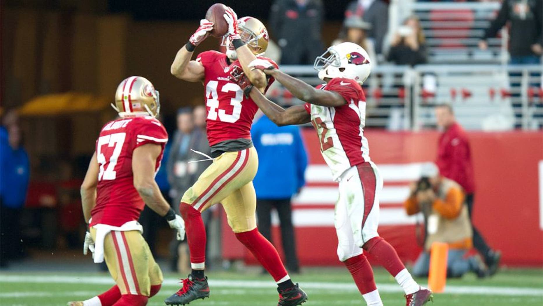 Dec 28, 2014; Santa Clara, CA, USA; San Francisco 49ers strong safety Craig Dahl (43) intercepts the ball from Arizona Cardinals quarterback Ryan Lindley (14, not pictured) during the fourth quarter at Levi's Stadium. The against the San Francisco 49ers defeated the Arizona Cardinals 20-17. Mandatory Credit: Ed Szczepanski-USA TODAY Sports