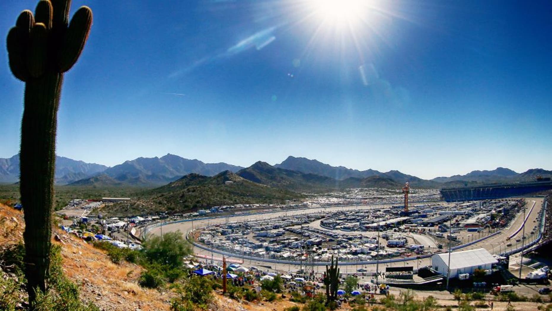 AVONDALE, AZ - NOVEMBER 09: (EDITOR'S NOTE: Image was processed using digital filters.) A general view of the speedway as cars race during the NASCAR Sprint Cup Series Quicken Loans Race for Heroes 500 at Phoenix International Raceway on November 9, 2014 in Avondale, Arizona. (Photo by Sean Gardner/NASCAR via Getty Images)