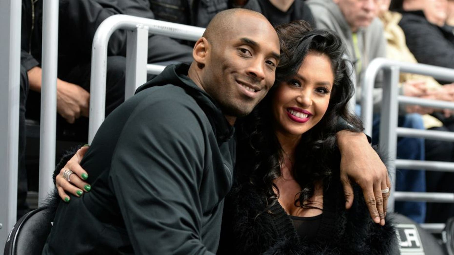 LOS ANGELES, CA - MARCH 09: Los Angeles Lakers Guard Kobe Bryant and his wife Vanessa Bryant pose for a photo during a game between the Los Angeles Kings and the Washington Capitals at STAPLES Center on March 09, 2016 in Los Angeles, California. (Photo by Andrew D. Bernstein/NHLI via Getty Images) *** Local Caption ***