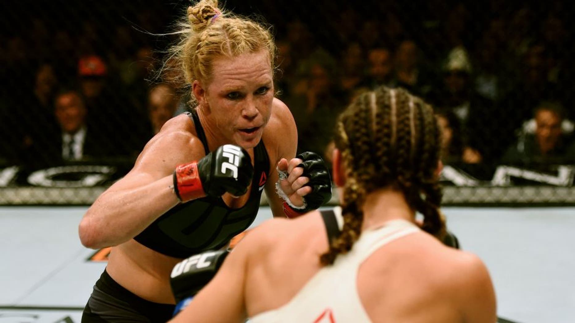 LAS VEGAS, NV - MARCH 05: (L-R) Holly Holm and Miesha Tate face off in their UFC women's bantamweight championship bout during the UFC 196 event inside MGM Grand Garden Arena on March 5, 2016 in Las Vegas, Nevada. (Photo by Josh Hedges/Zuffa LLC/Zuffa LLC via Getty Images)