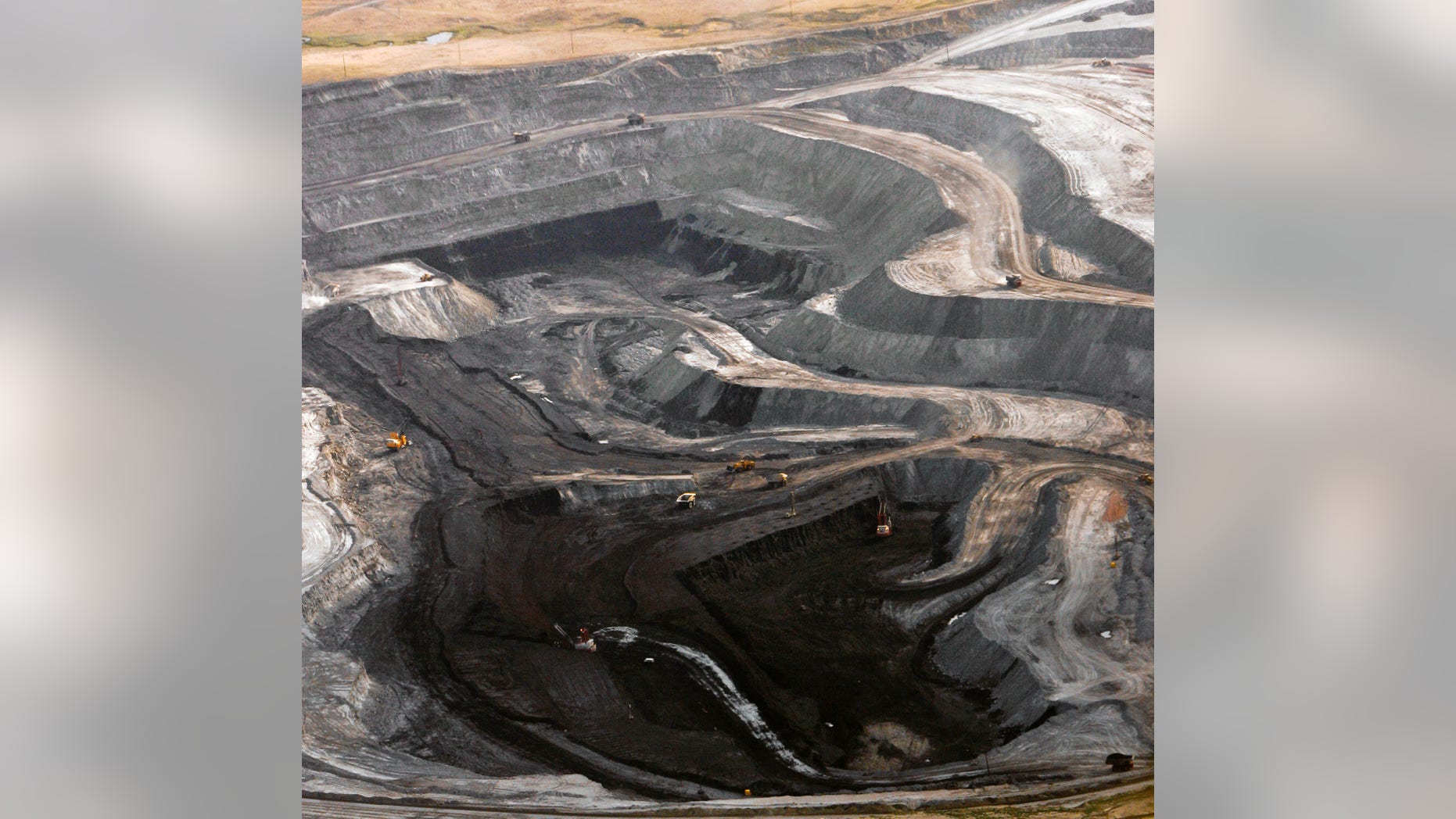 FILE - This Aug. 22, 2006 file photo shows a coal mine seen from the air in northeast Wyoming near Gillette, Wyo. A spokesman for U.S. Sen. Lisa Murkowski said Friday, Feb. 8, 2013 that federal review has so far found no evidence mining companies knowingly skirted royalty rules as they've increased coal exports to Asia. (AP Photo/Nati Harnik, File)