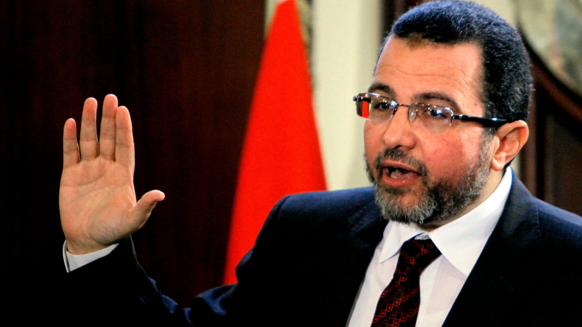 FILE - In this Sunday, Dec. 30, 2012 file photo, Egyptian Prime Minister Hesham Kandil talks during a press conference at his office in Cairo, Egypt. Egypt’s prime minister caused an uproar after blaming health problems for babies in poor villages on women who nurse them without cleaning their breasts. Critics say the remarks show Hesham Kandil is out of his depth as prime minister. (AP Photo/Amr Nabil, File)