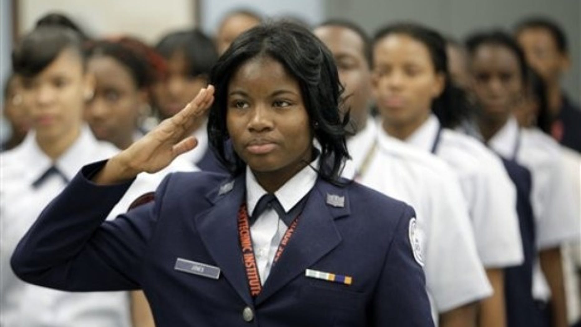 Nov. 12, 2009: Baltimore Polytechnic Institute Air Force Junior ROTC cadet Kwameka Jones salutes before her squad practiced drills.