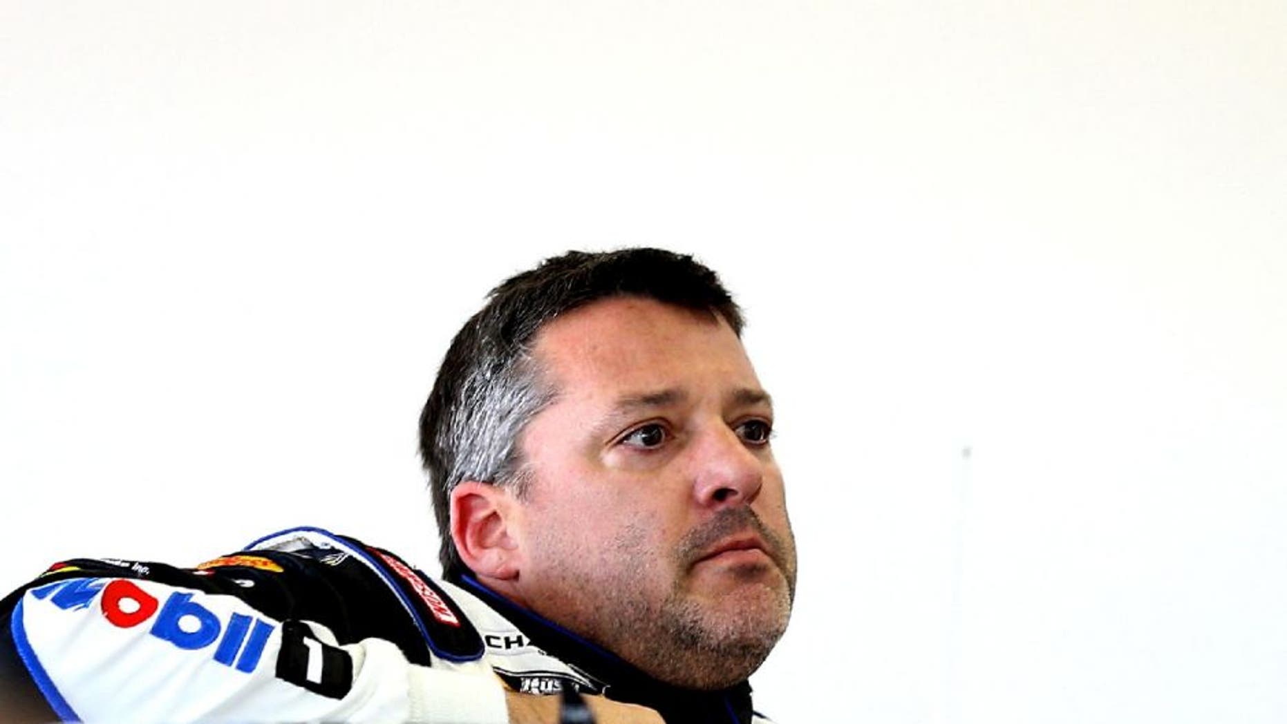 LAS VEGAS, NV - MARCH 06: Tony Stewart, driver of the #14 Mobil 1/Bass Pro Shops Chevrolet, stands in the garage during practice for the NASCAR Sprint Cup Series Kobalt 400 at Las Vegas Motor Speedway on March 6, 2015 in Las Vegas, Nevada. (Photo by Patrick Smith/NASCAR via Getty Images)