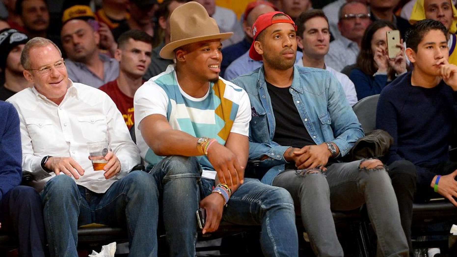 Mar 10, 2016; Los Angeles, CA, USA; Carolina Panthers quarterback Cam Newton attends the game between the Los Angeles Lakers and the Cleveland Cavaliers at Staples Center. Mandatory Credit: Jayne Kamin-Oncea-USA TODAY Sports